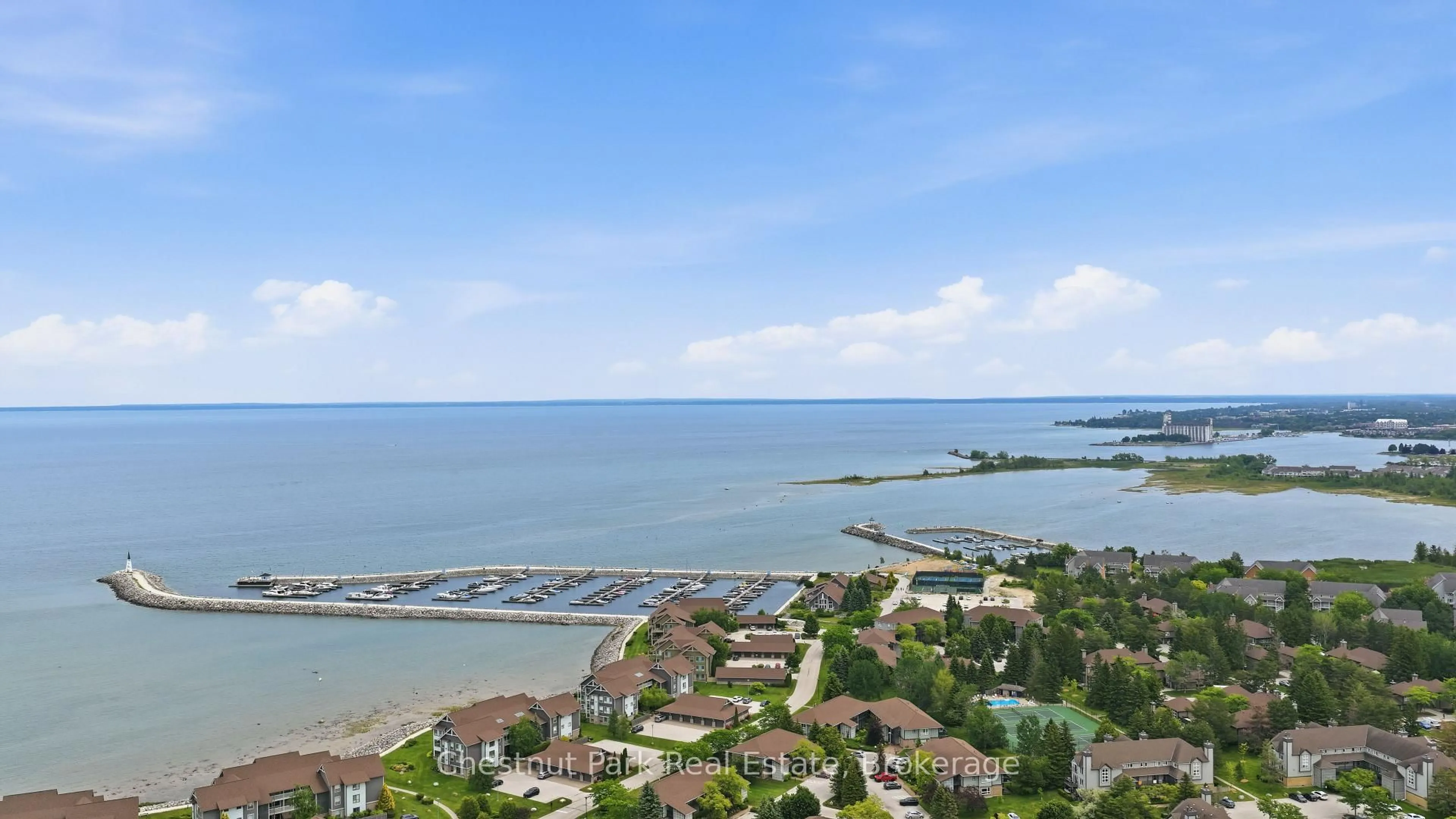 A pic from outside/outdoor area/front of a property/back of a property/a pic from drone, water/lake/river/ocean view for 504 Mariners Way, Collingwood Ontario L9Y 5C7