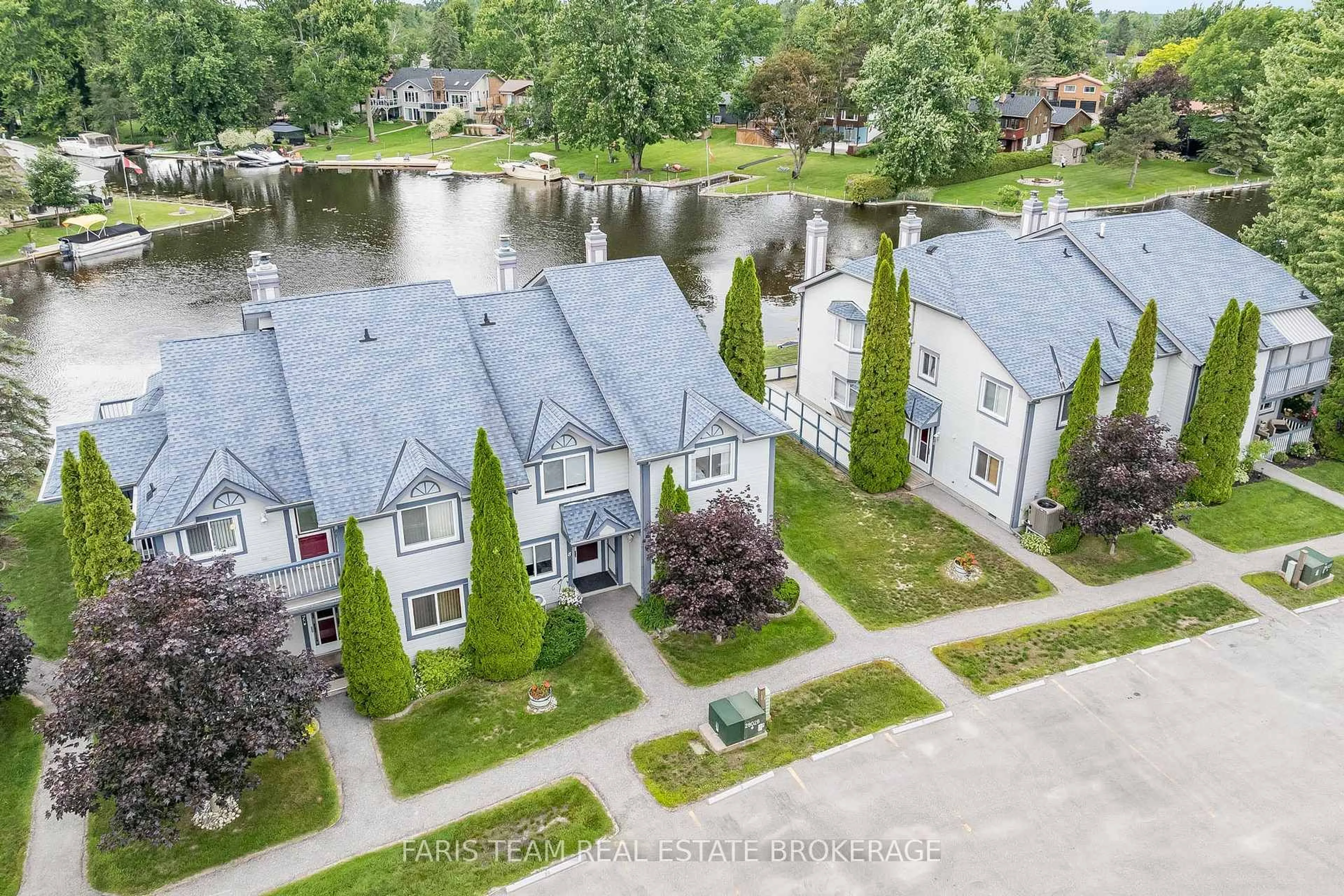 A pic from outside/outdoor area/front of a property/back of a property/a pic from drone, water/lake/river/ocean view for 10 Laguna Pkwy #9, Ramara Ontario L0K 1B0