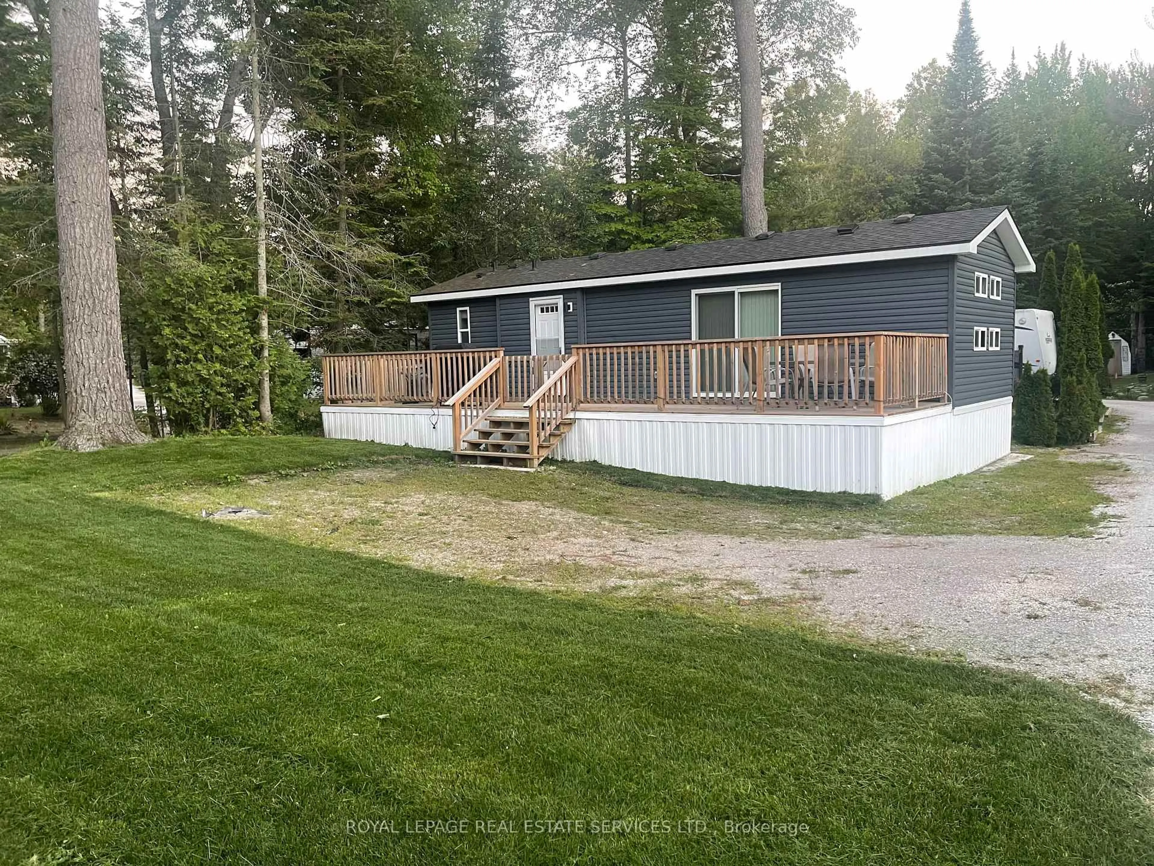 A pic from outside/outdoor area/front of a property/back of a property/a pic from drone, unknown for 85 Theme Park Dr, Wasaga Beach Ontario L9Z 1X7