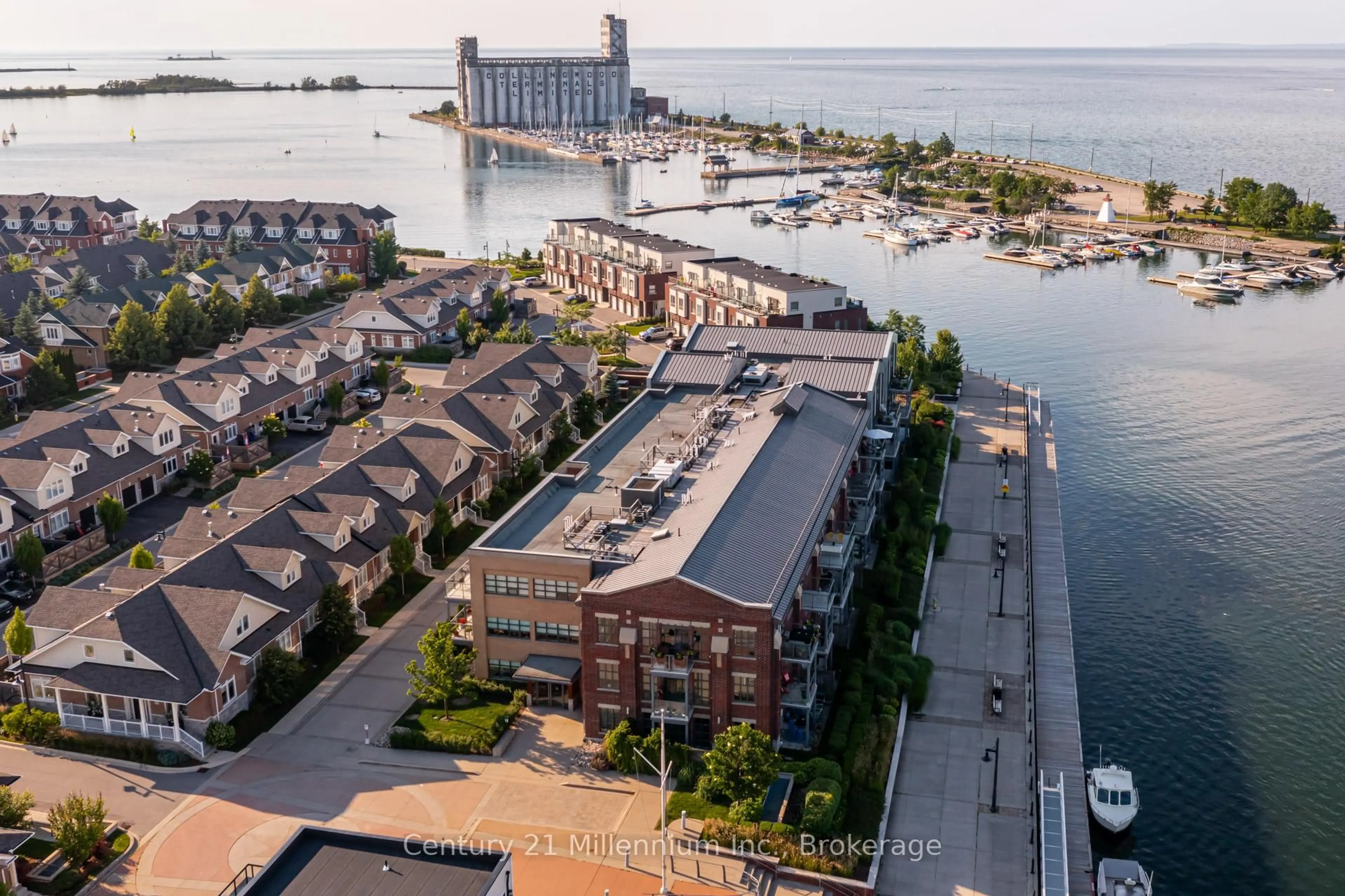 A pic from outside/outdoor area/front of a property/back of a property/a pic from drone, water/lake/river/ocean view for 1 Shipyard Lane #209, Collingwood Ontario L9Y 0W2