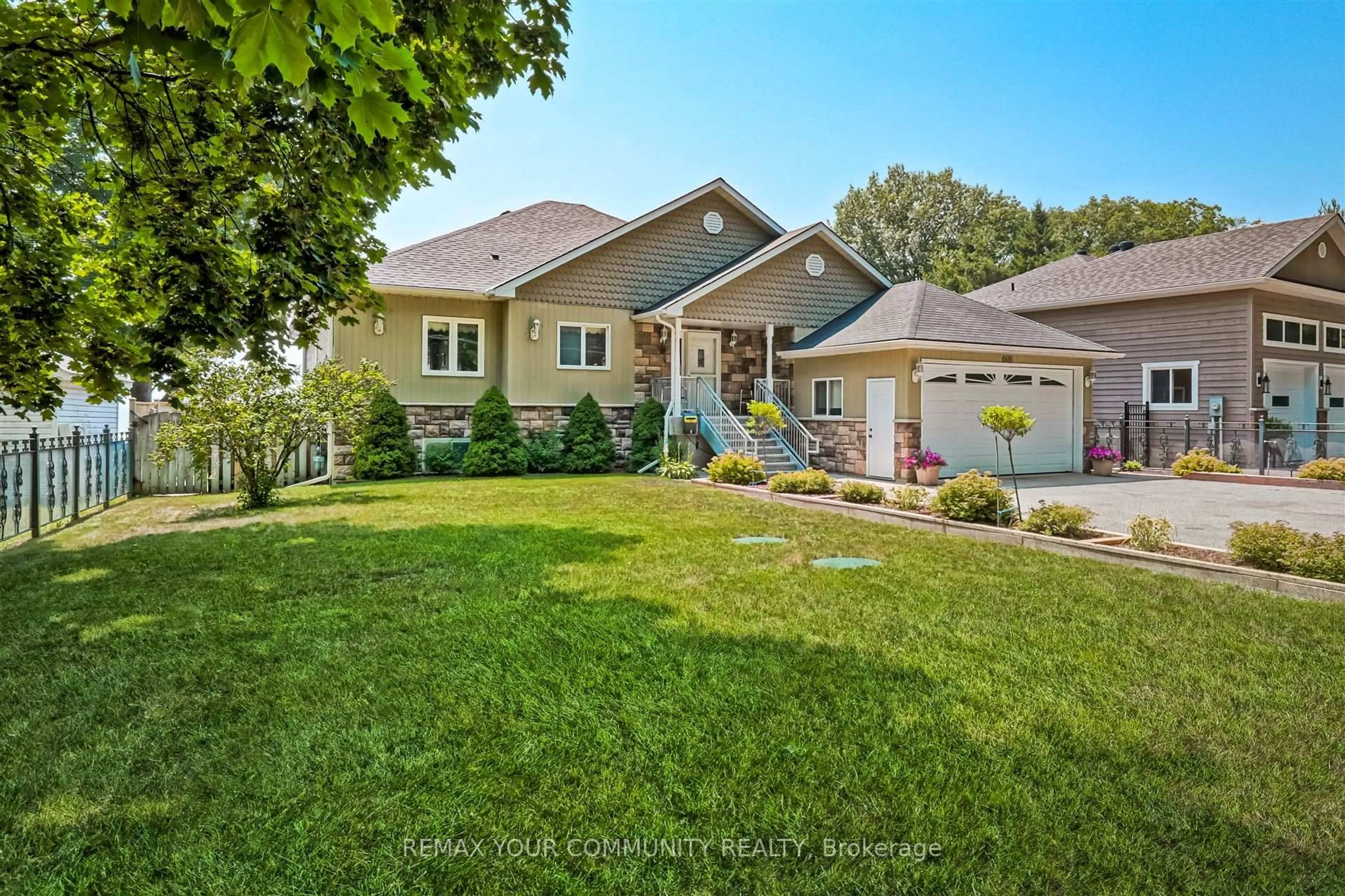 Home with vinyl exterior material, street for 1834 Tiny Beaches Rd, Tiny Ontario L0L 1P1