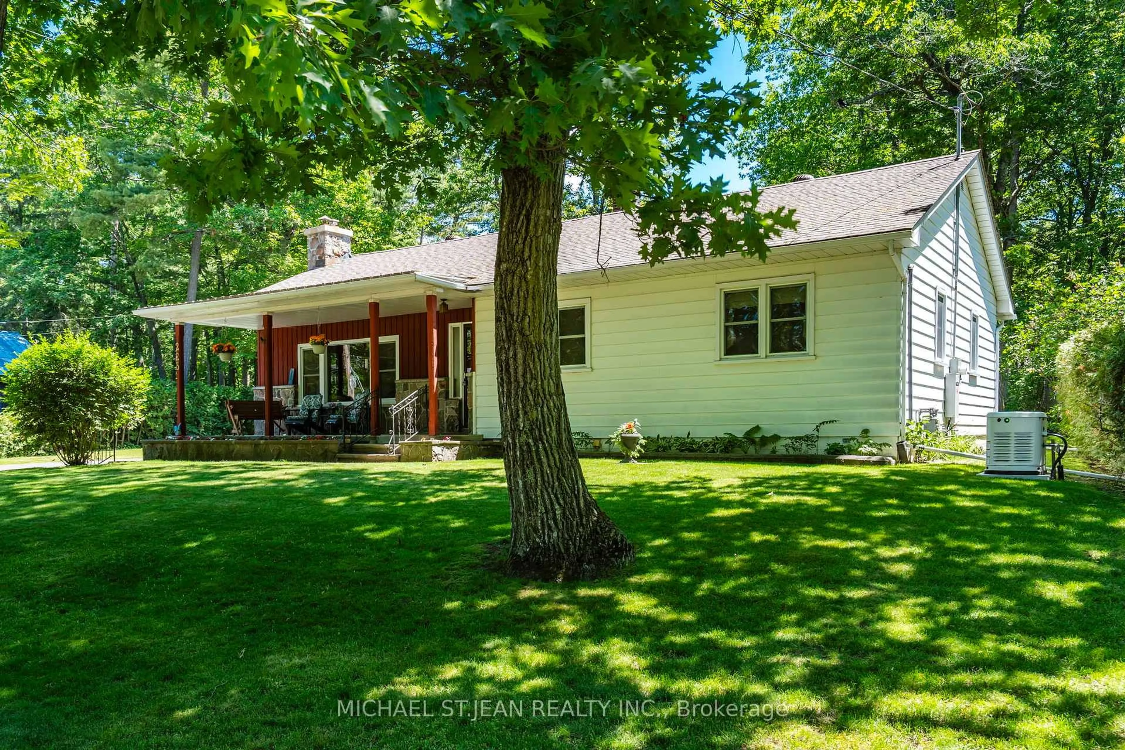 A pic from outside/outdoor area/front of a property/back of a property/a pic from drone, street for 223 Tiny Beaches Rd, Tiny Ontario L0L 2J0