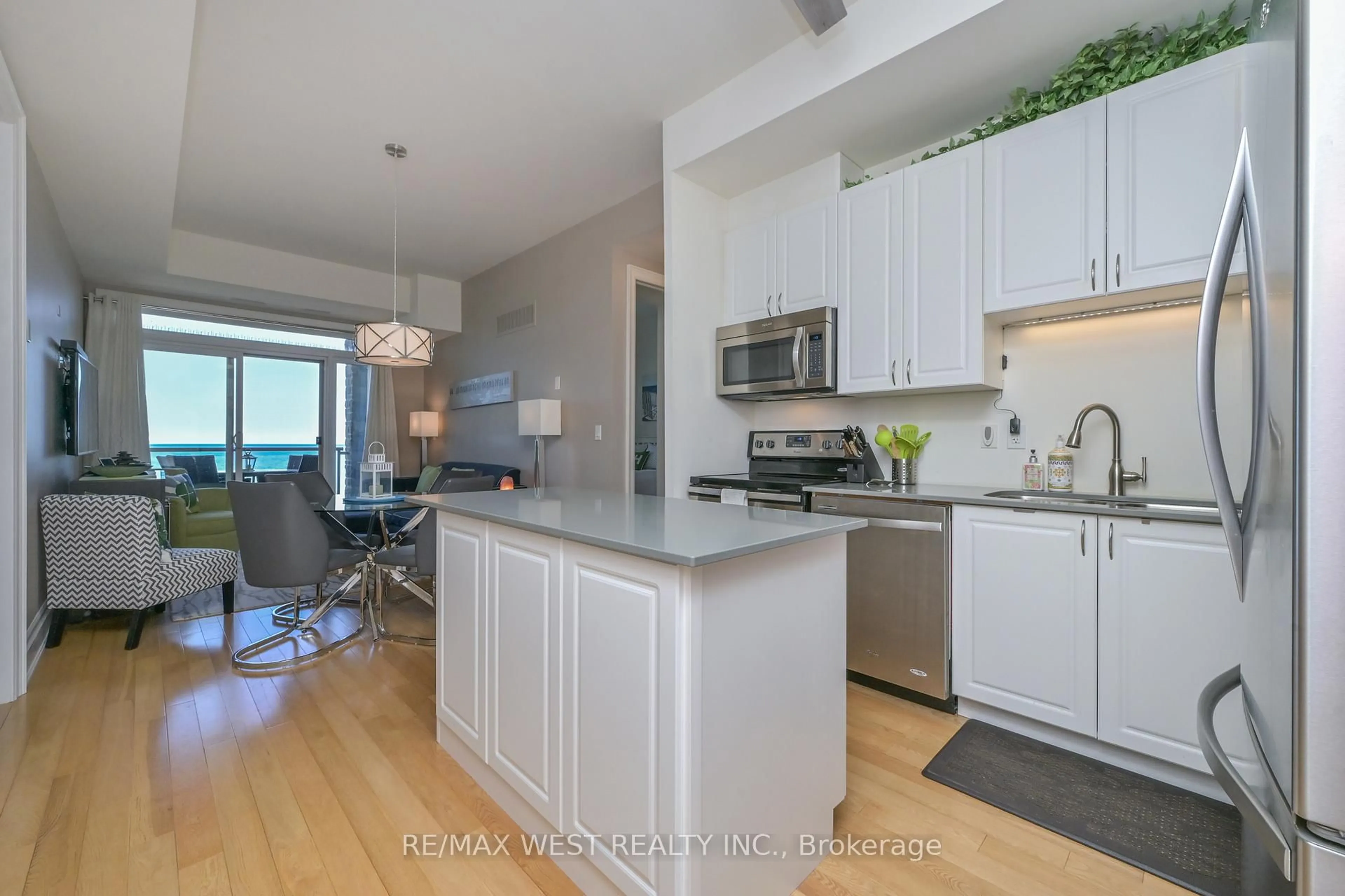 Open concept kitchen, wood/laminate floor for 764 RIVER Rd #212, Wasaga Beach Ontario L9Z 2M7
