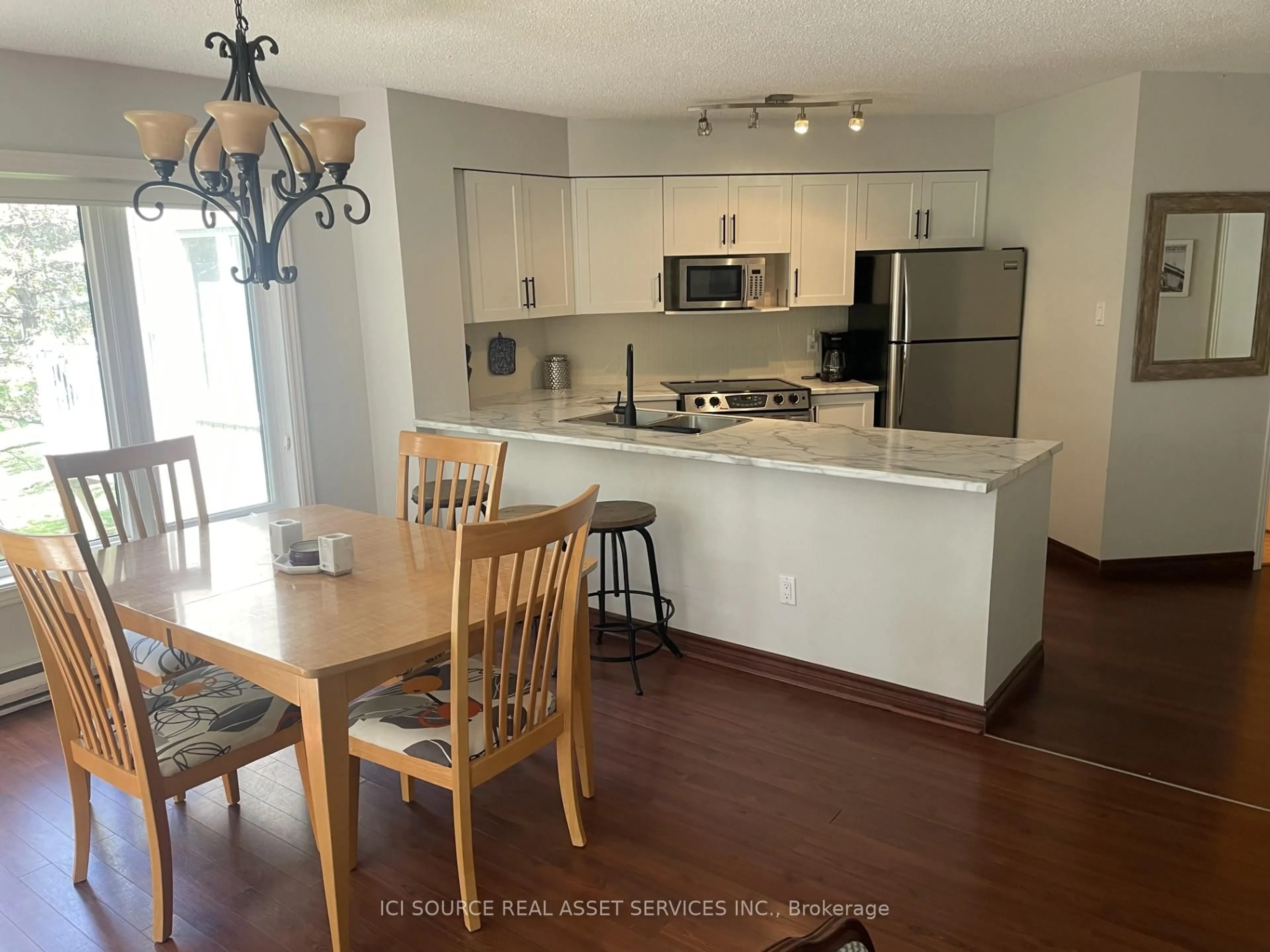 Open concept kitchen, wood/laminate floor for 18 Ramblings Way #97, Collingwood Ontario L9Y 5C6