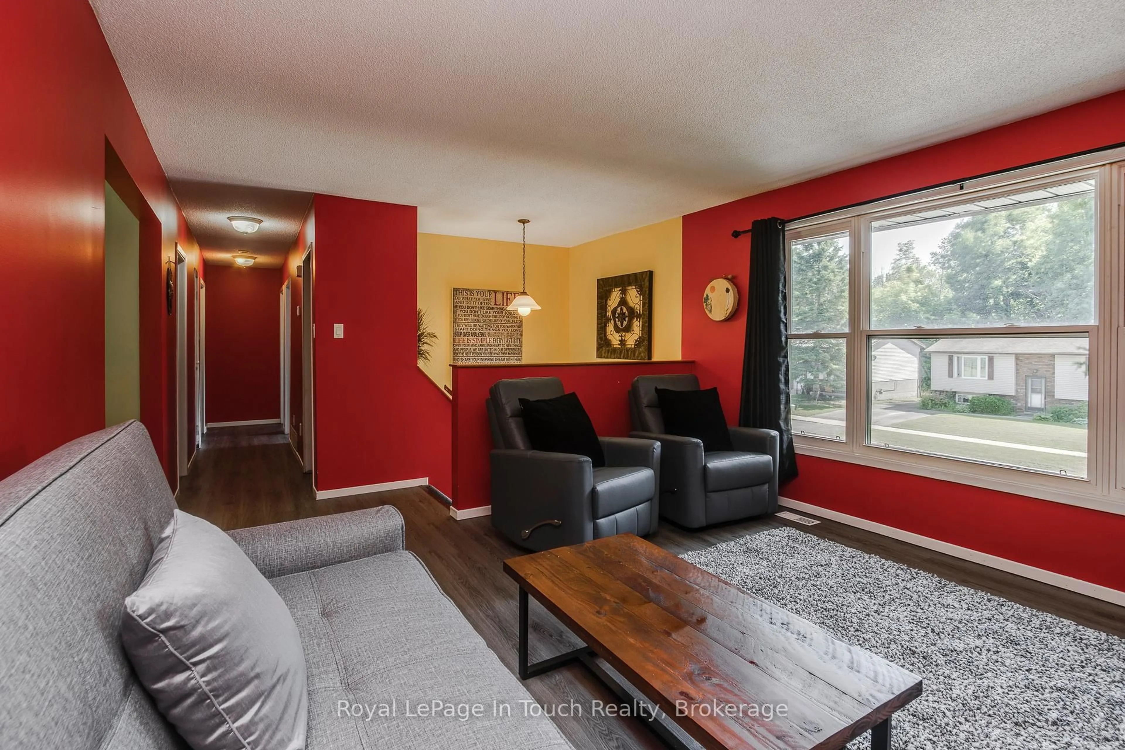 Living room with furniture, wood/laminate floor for 817 Birchwood Dr, Midland Ontario L4R 4Y3