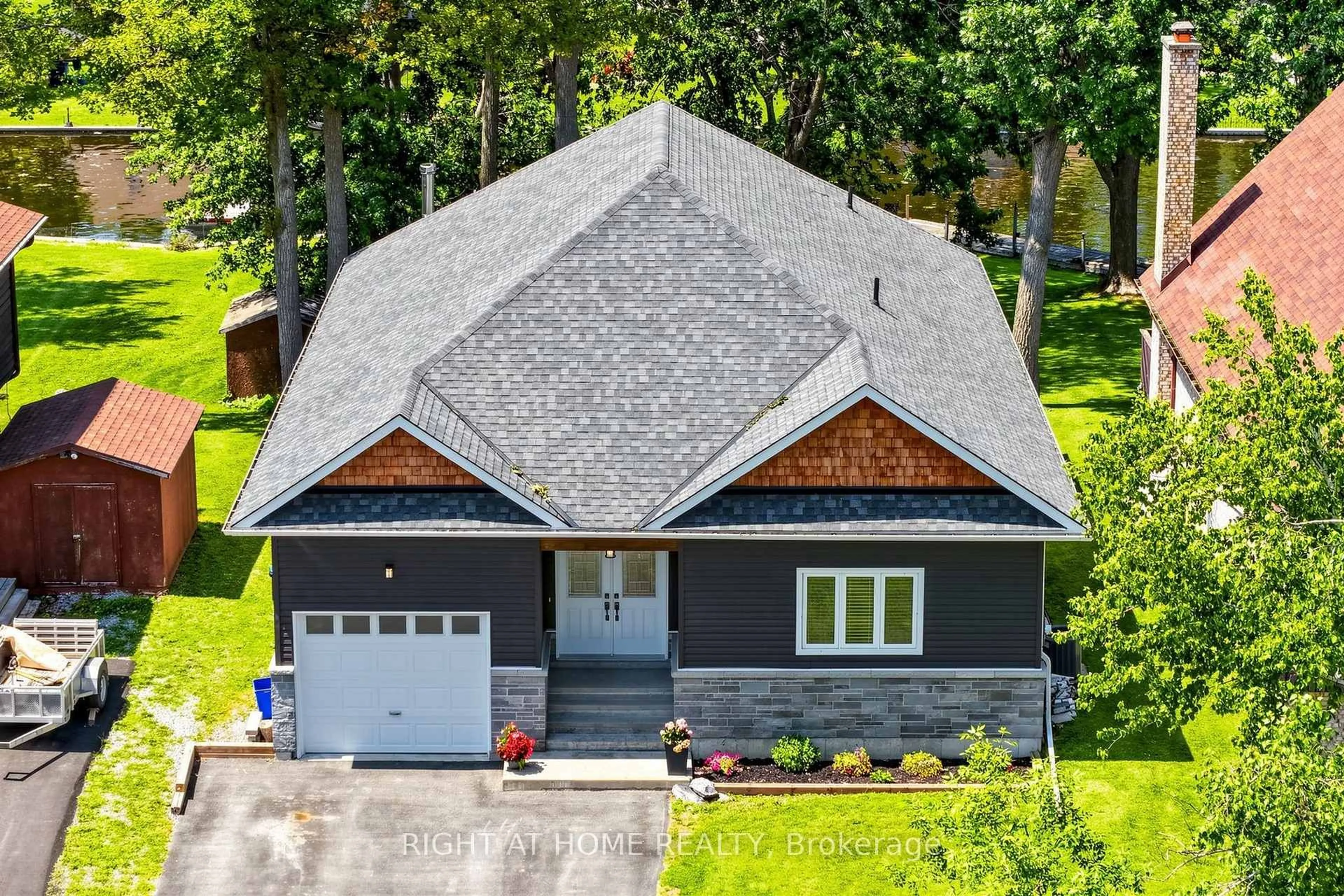 A pic from outside/outdoor area/front of a property/back of a property/a pic from drone, unknown for 48 Ridge Ave, Ramara Ontario L0K 1B0