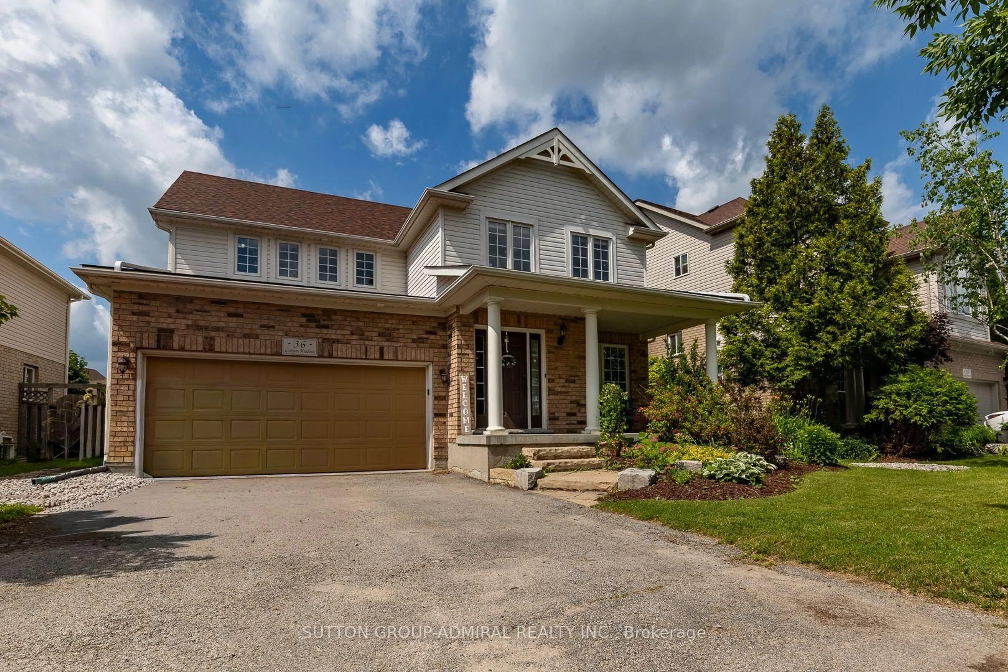 Home with brick exterior material, street for 36 Georgian Meadows Dr, Collingwood Ontario L9Y 5H2