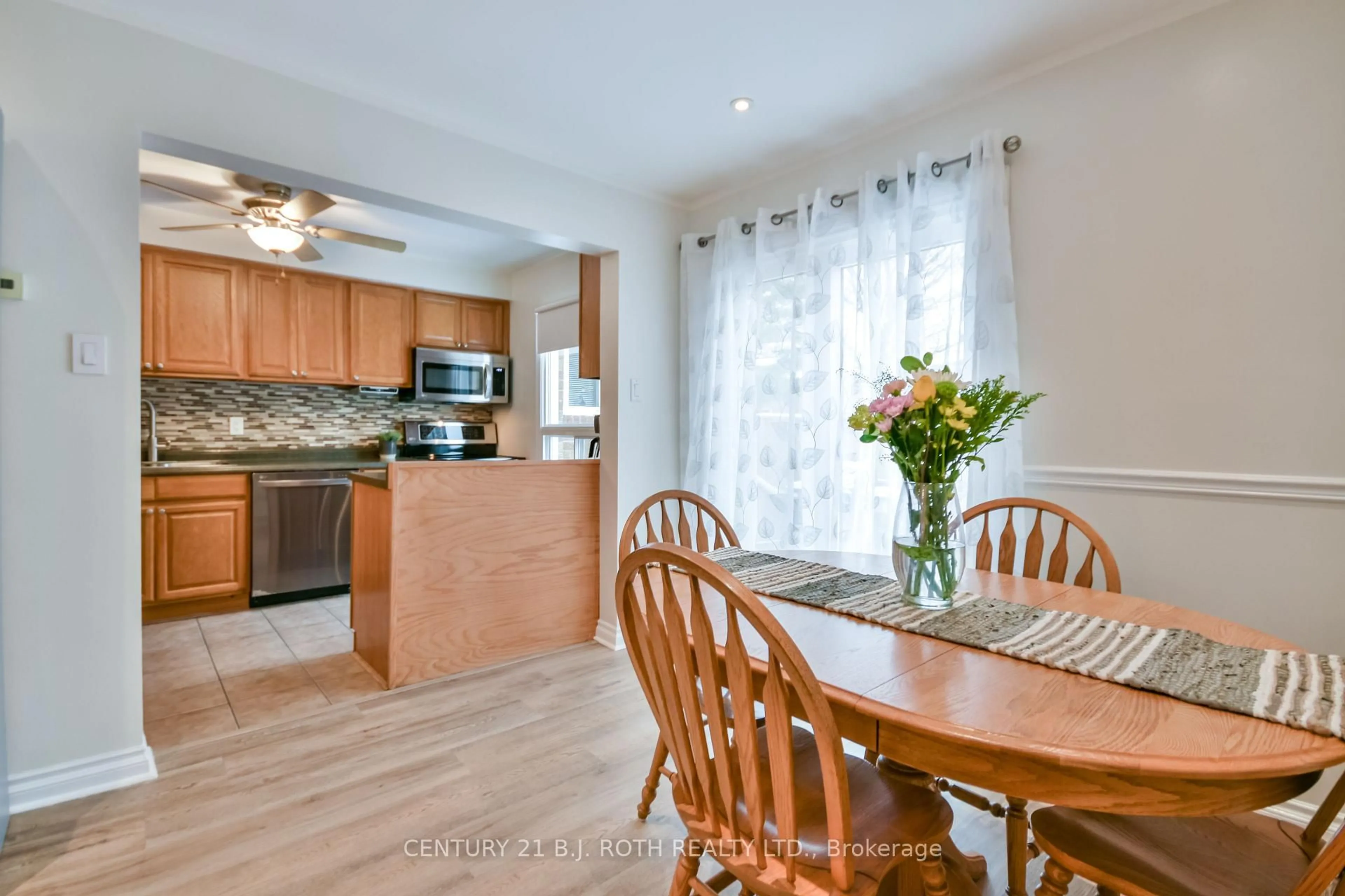 Open concept kitchen, wood/laminate floor for 165 Kozlov St #43, Barrie Ontario L4N 7M7