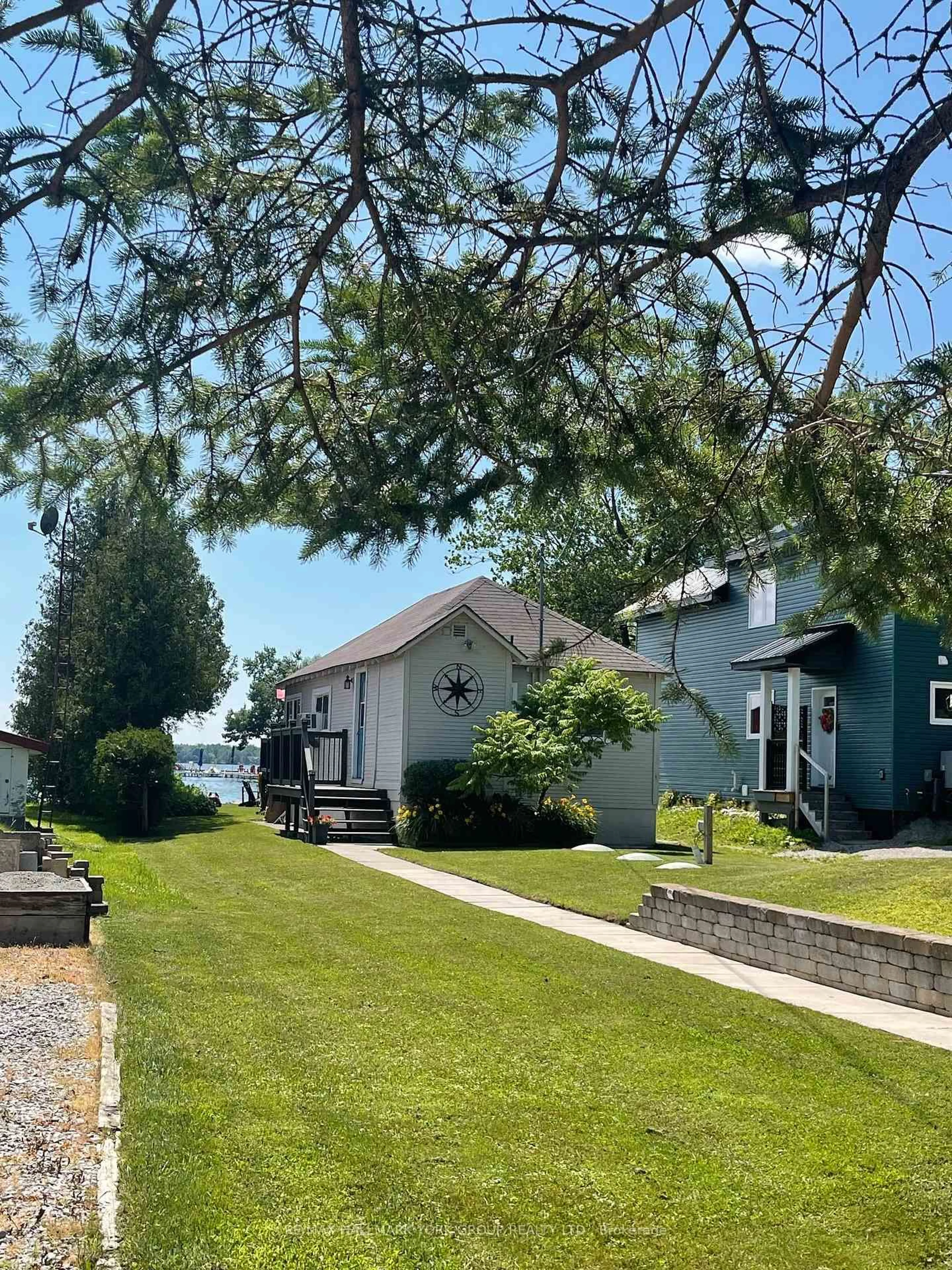 A pic from outside/outdoor area/front of a property/back of a property/a pic from drone, street for 4464 Plum Point Rd, Ramara Ontario L0K 2B0
