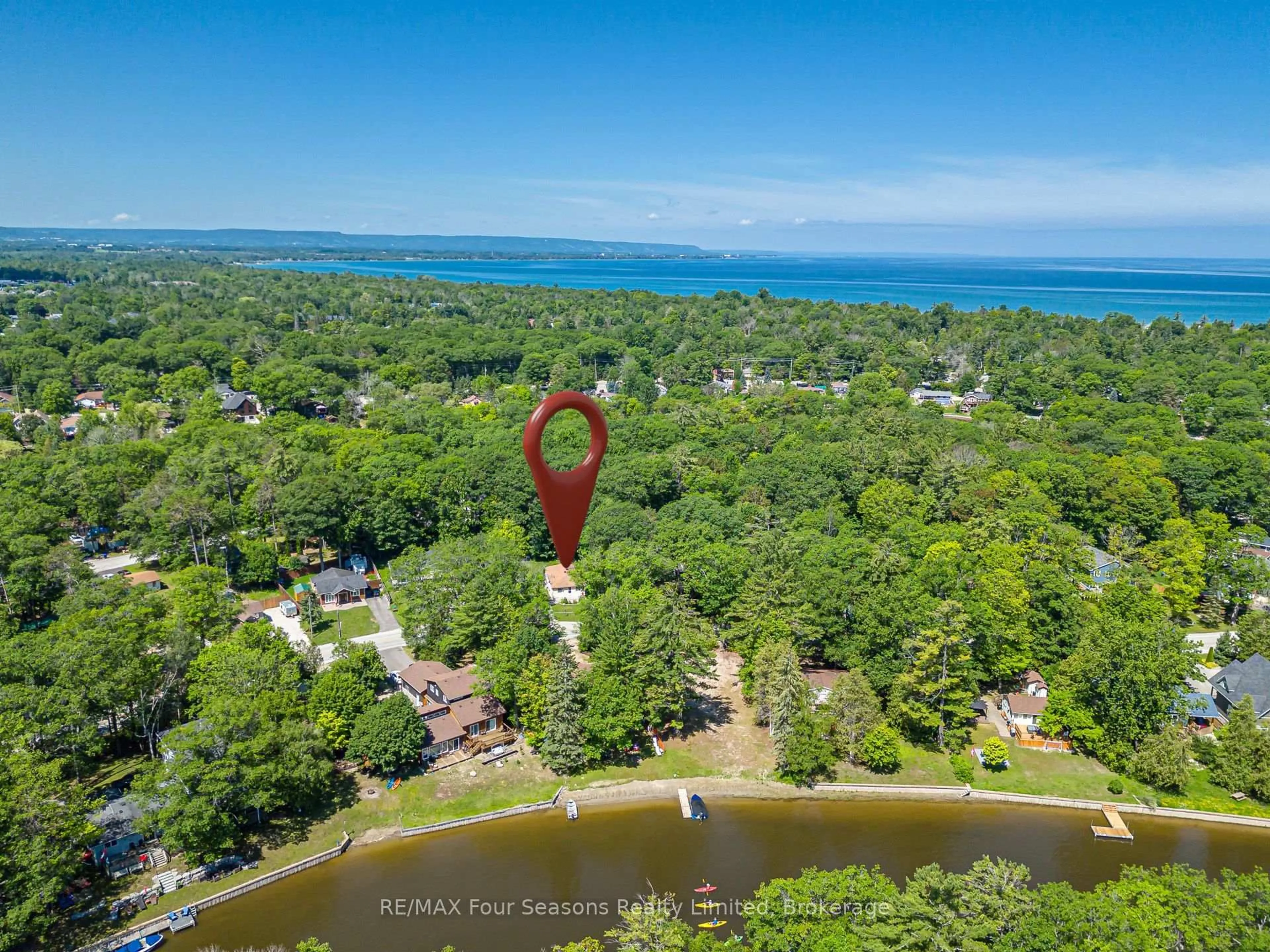 A pic from outside/outdoor area/front of a property/back of a property/a pic from drone, water/lake/river/ocean view for 511 Oxbow Park Dr, Wasaga Beach Ontario L9Z 2T8
