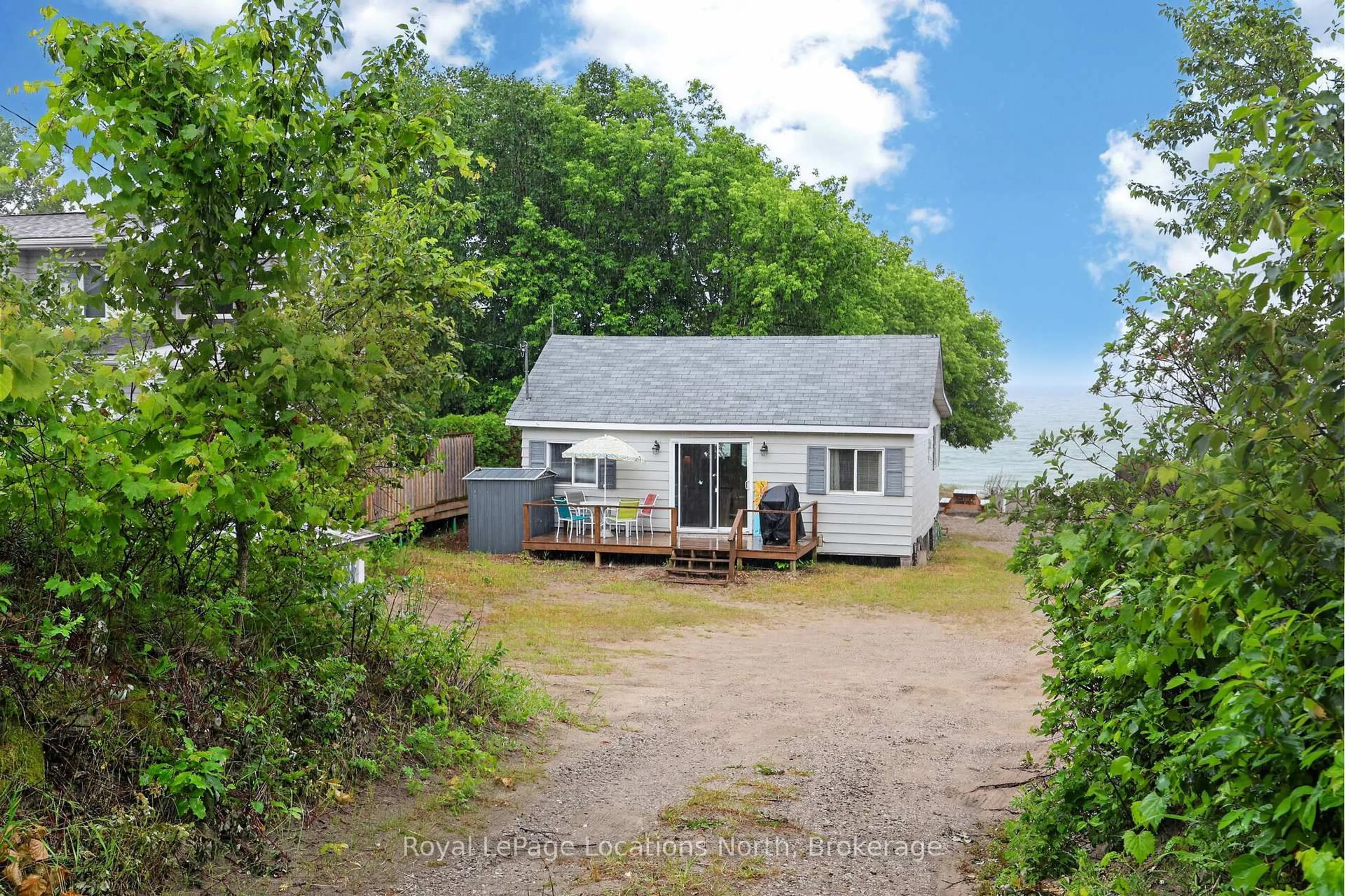 A pic from outside/outdoor area/front of a property/back of a property/a pic from drone, street for 2134 Tiny Beaches Rd, Tiny Ontario L0L 1P1