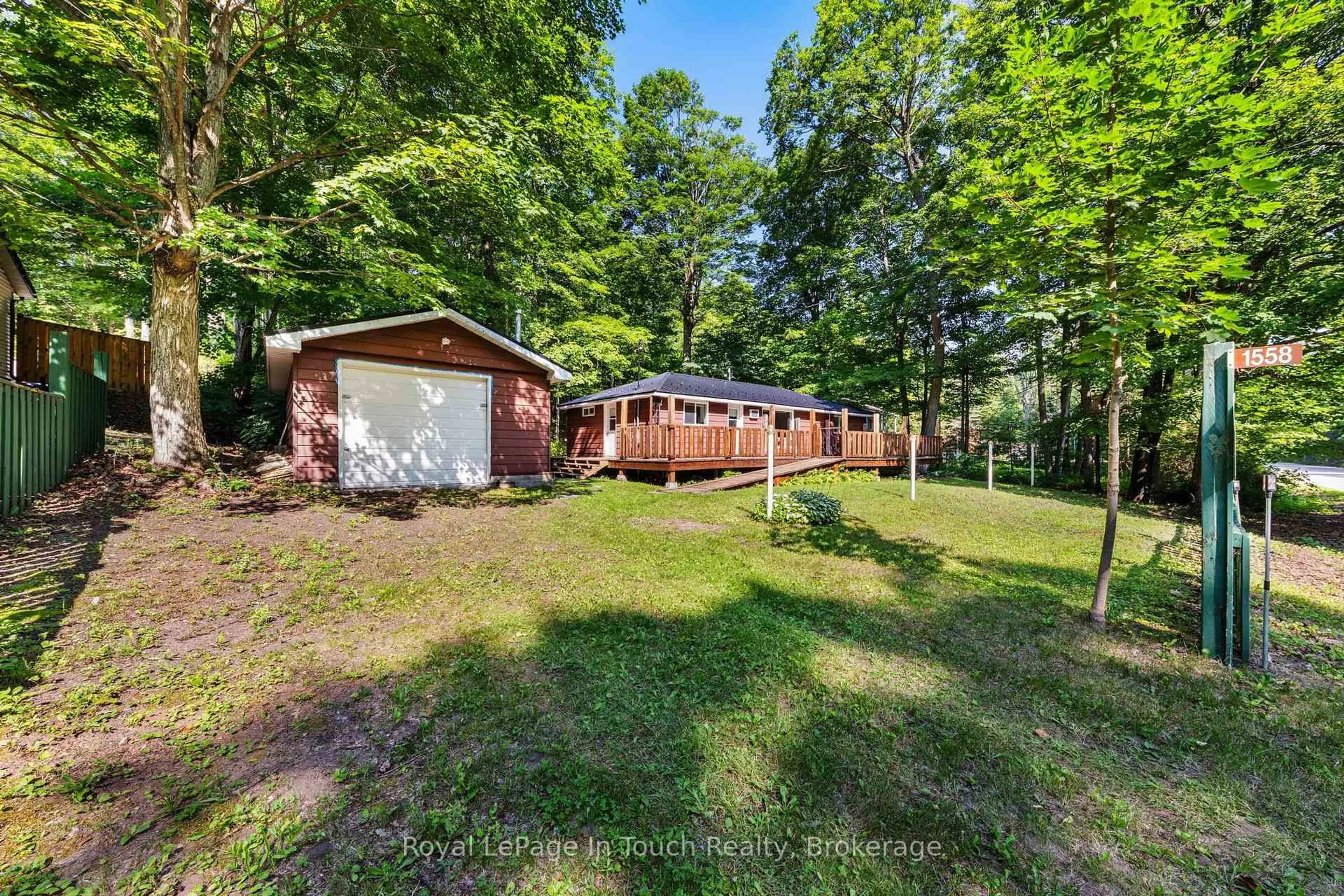A pic from outside/outdoor area/front of a property/back of a property/a pic from drone, forest/trees view for 1558 Champlain Rd, Tiny Ontario L9M 0C1