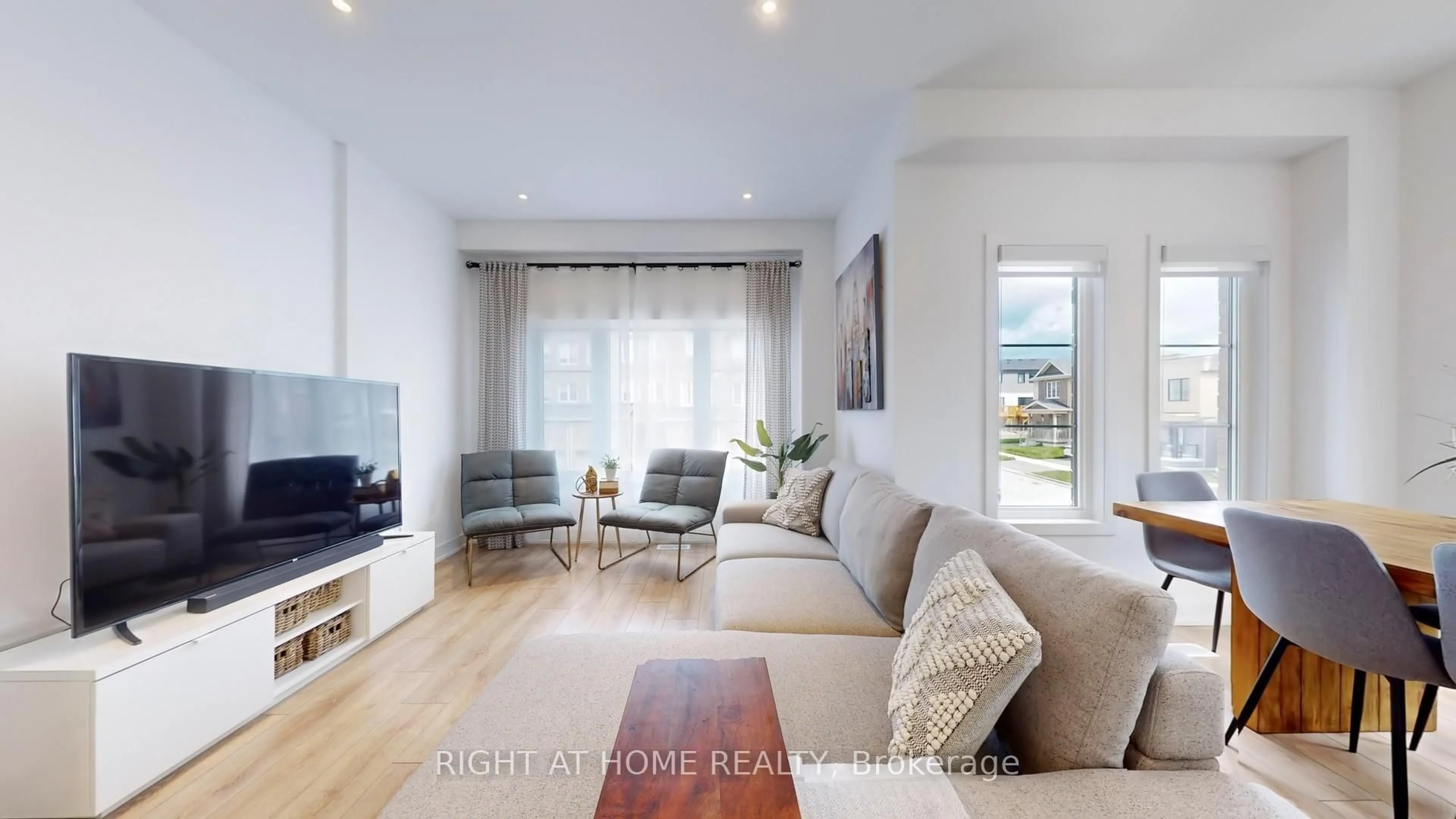 Living room with furniture, wood/laminate floor for 1 PUMPKIN CORNER Cres, Barrie Ontario L9J 0T5