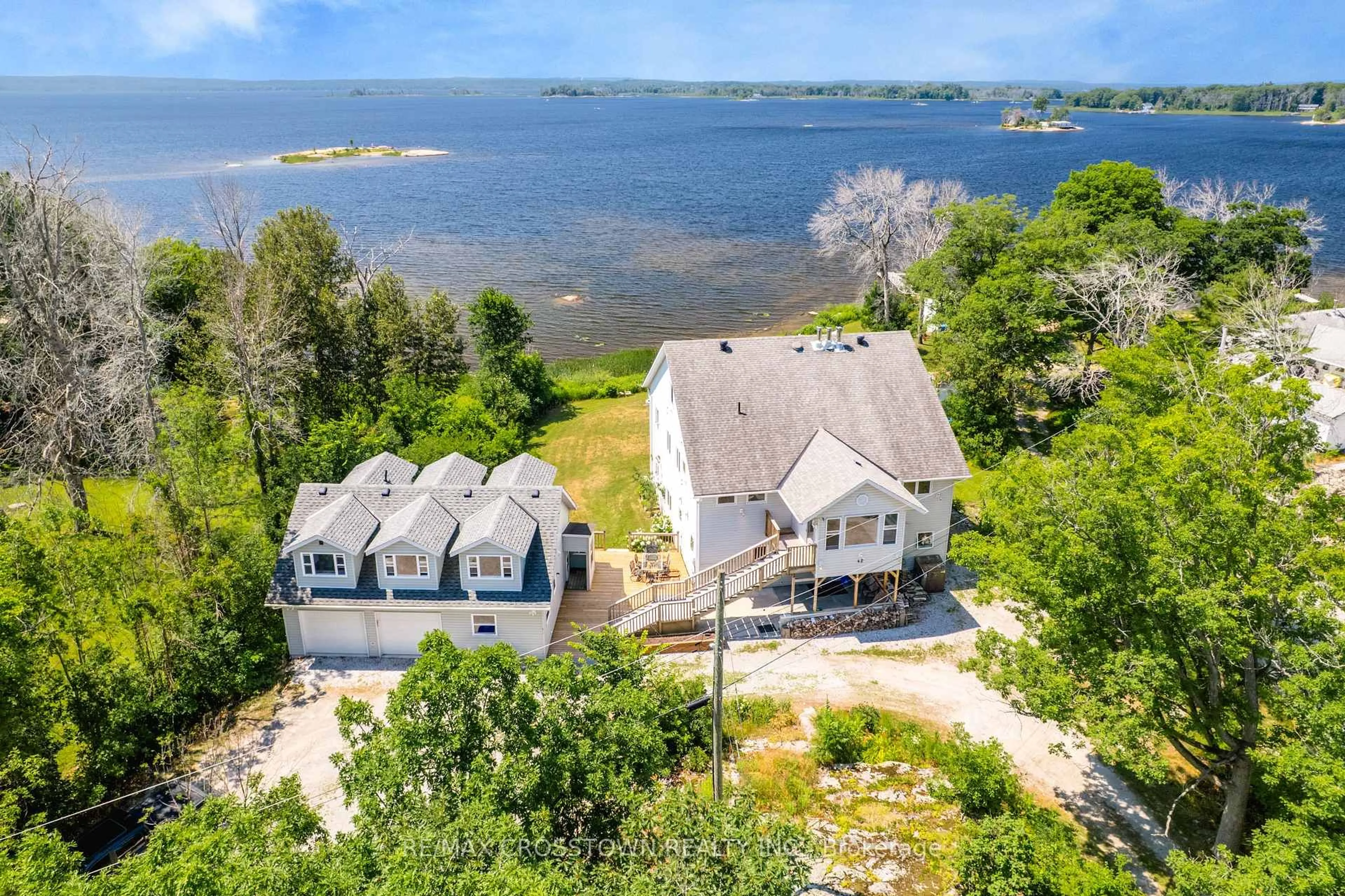 A pic from outside/outdoor area/front of a property/back of a property/a pic from drone, water/lake/river/ocean view for 42 Bluff Point Rd, Tay Ontario L0K 2C0