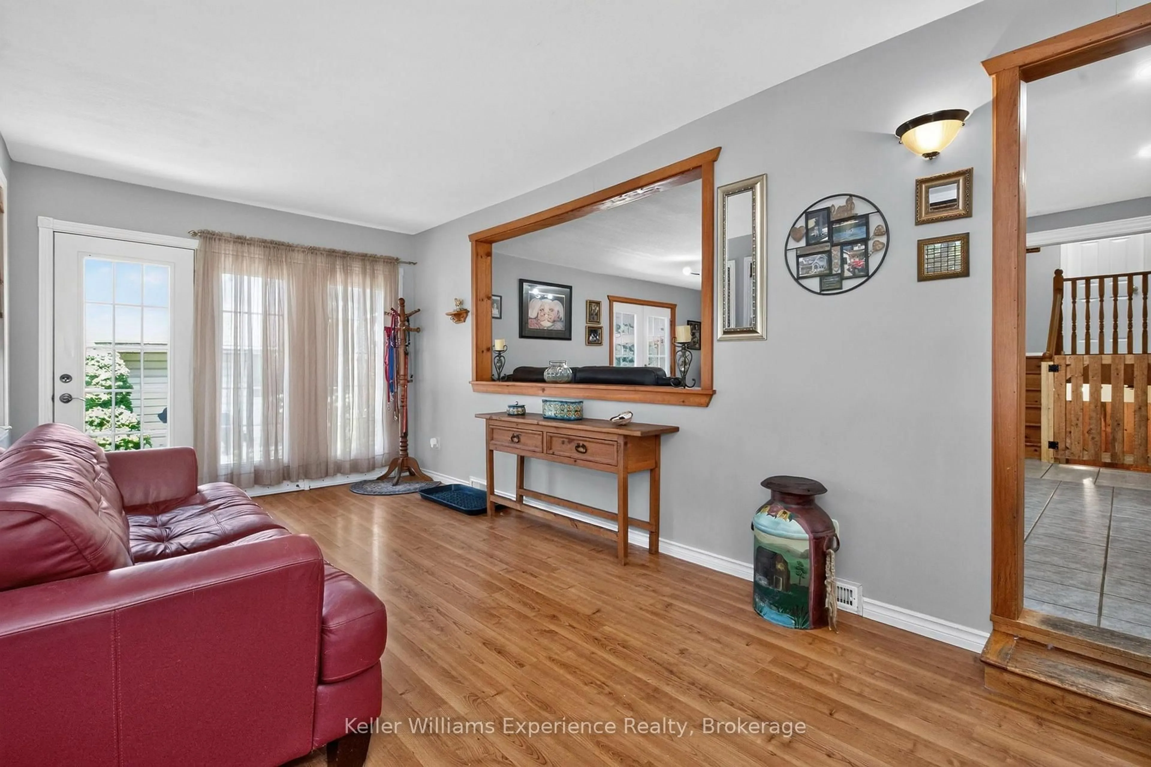 Living room with furniture, wood/laminate floor for 281 Park St, Tay Ontario L0K 2A0