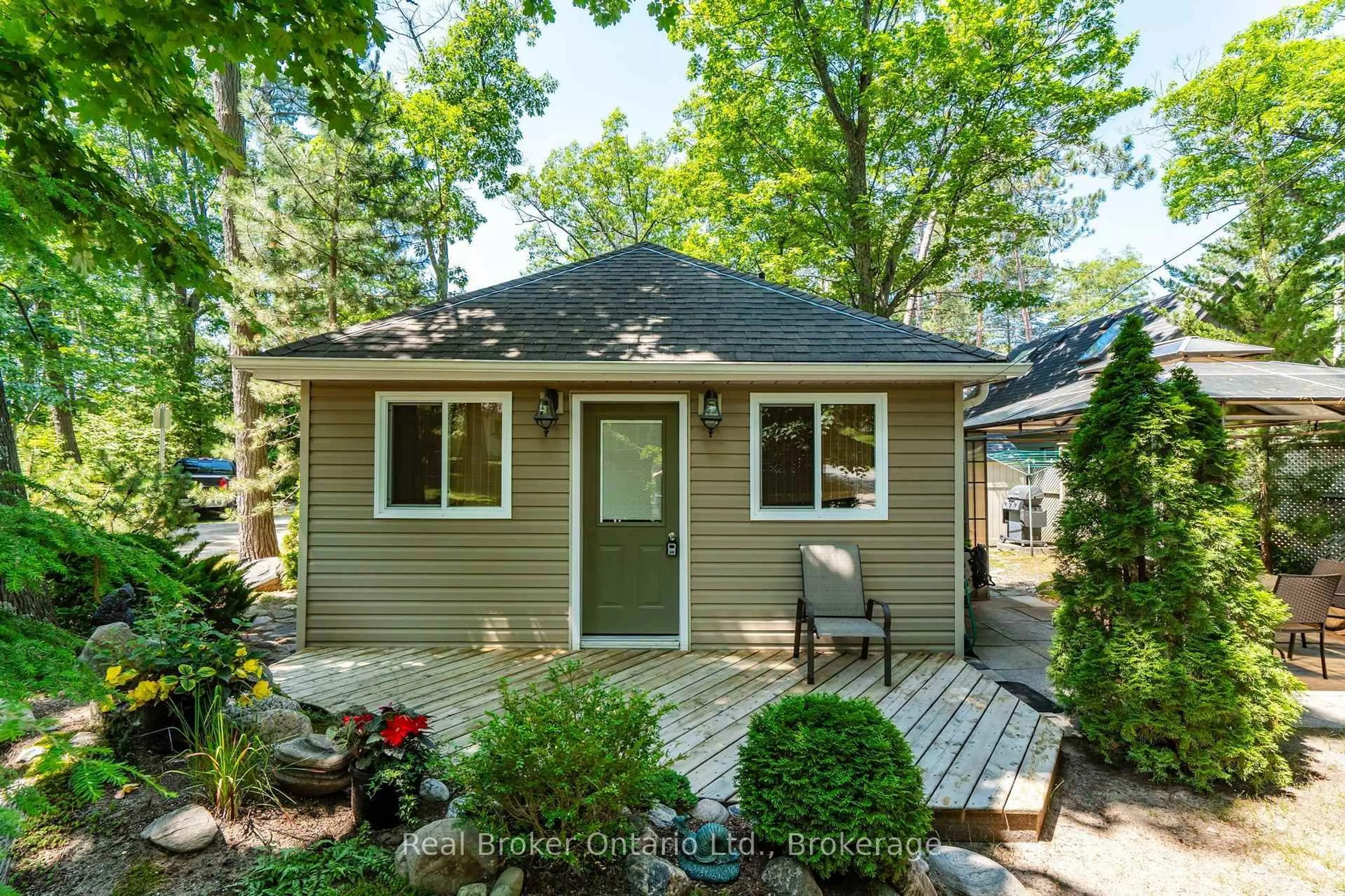Home with vinyl exterior material, street for 224 Tiny Beaches Road S Rd, Tiny Ontario L0L 2J0