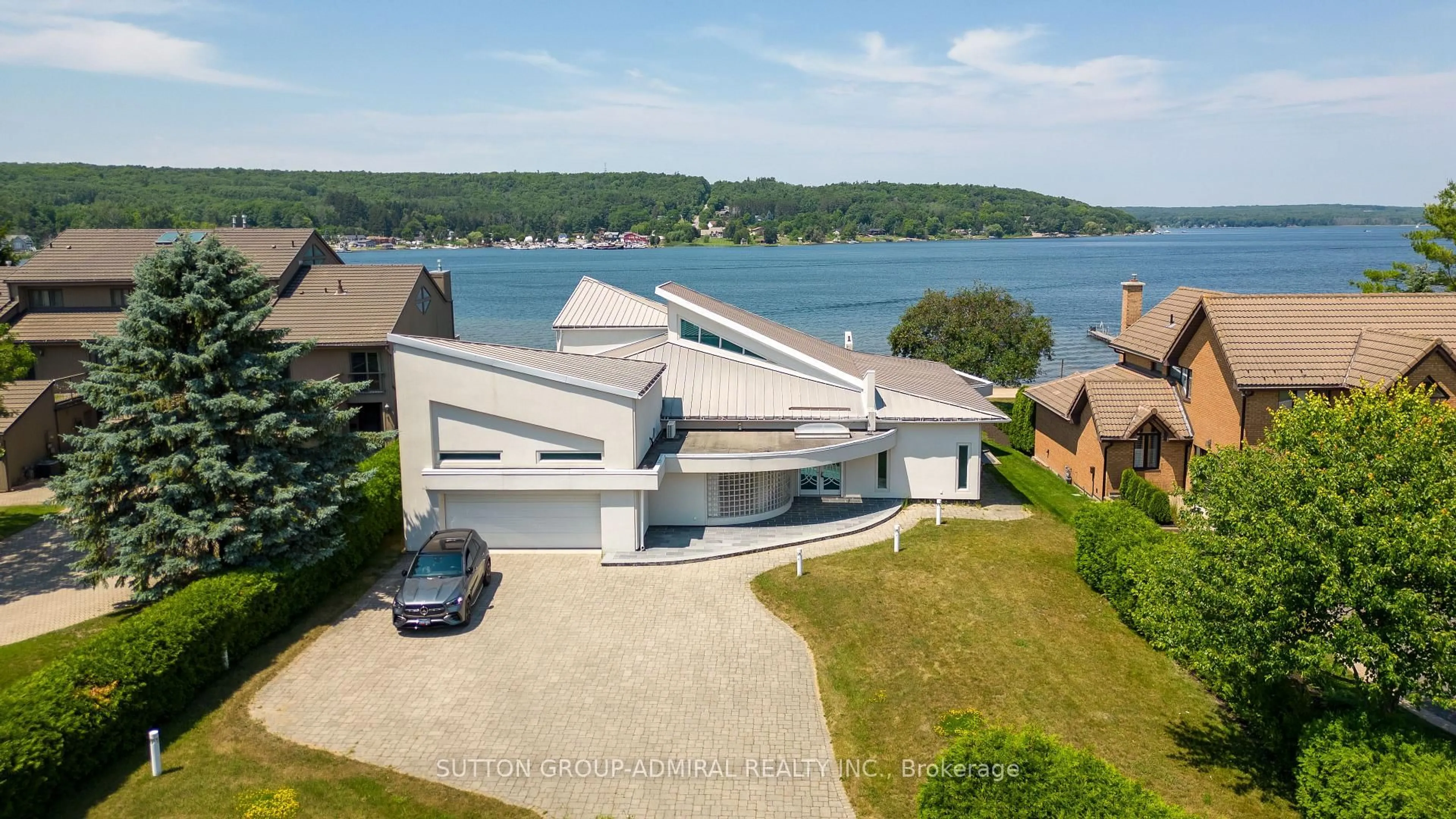 A pic from outside/outdoor area/front of a property/back of a property/a pic from drone, water/lake/river/ocean view for 10 Beck Blvd, Penetanguishene Ontario L9M 1C3