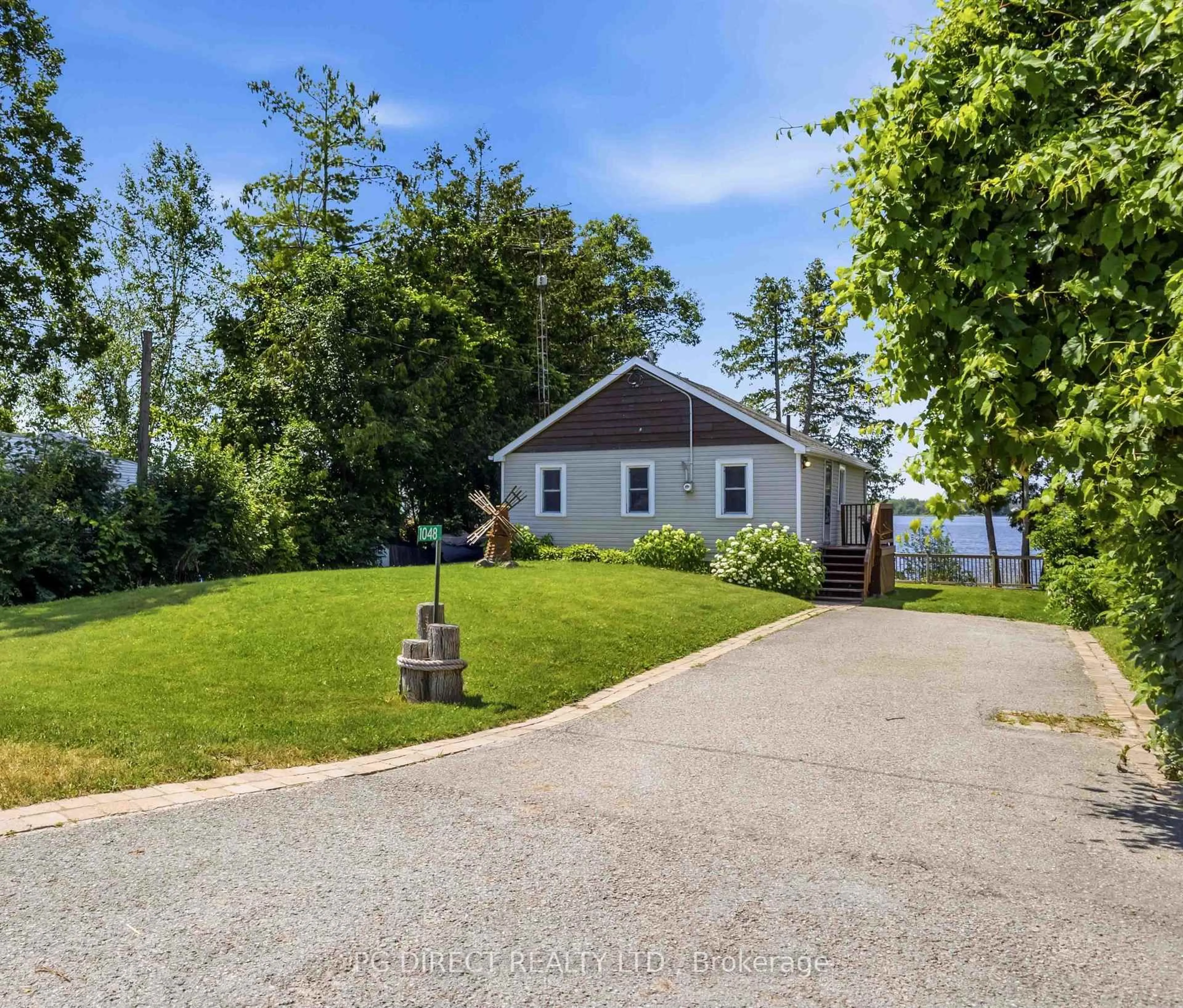 A pic from outside/outdoor area/front of a property/back of a property/a pic from drone, water/lake/river/ocean view for 1048 Sylvan Glen Dr, Ramara Ontario L0K 1B0