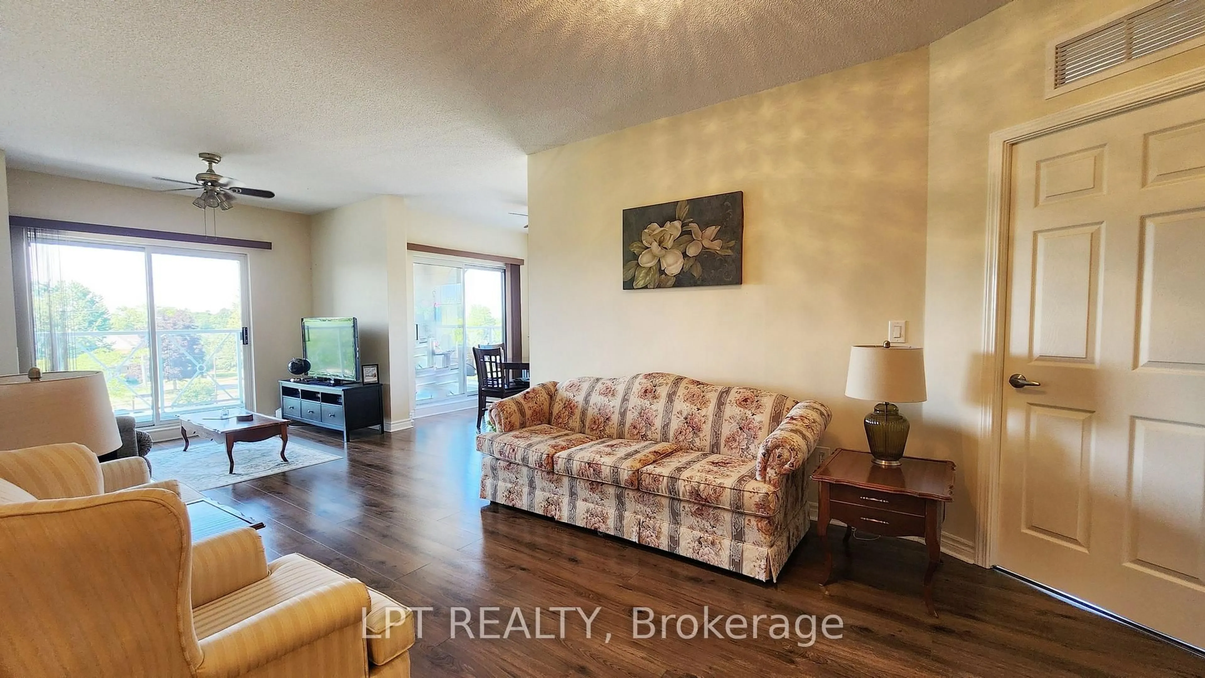 Living room with furniture, wood/laminate floor for 354 Atherley Rd #303, Orillia Ontario L3V 0B8