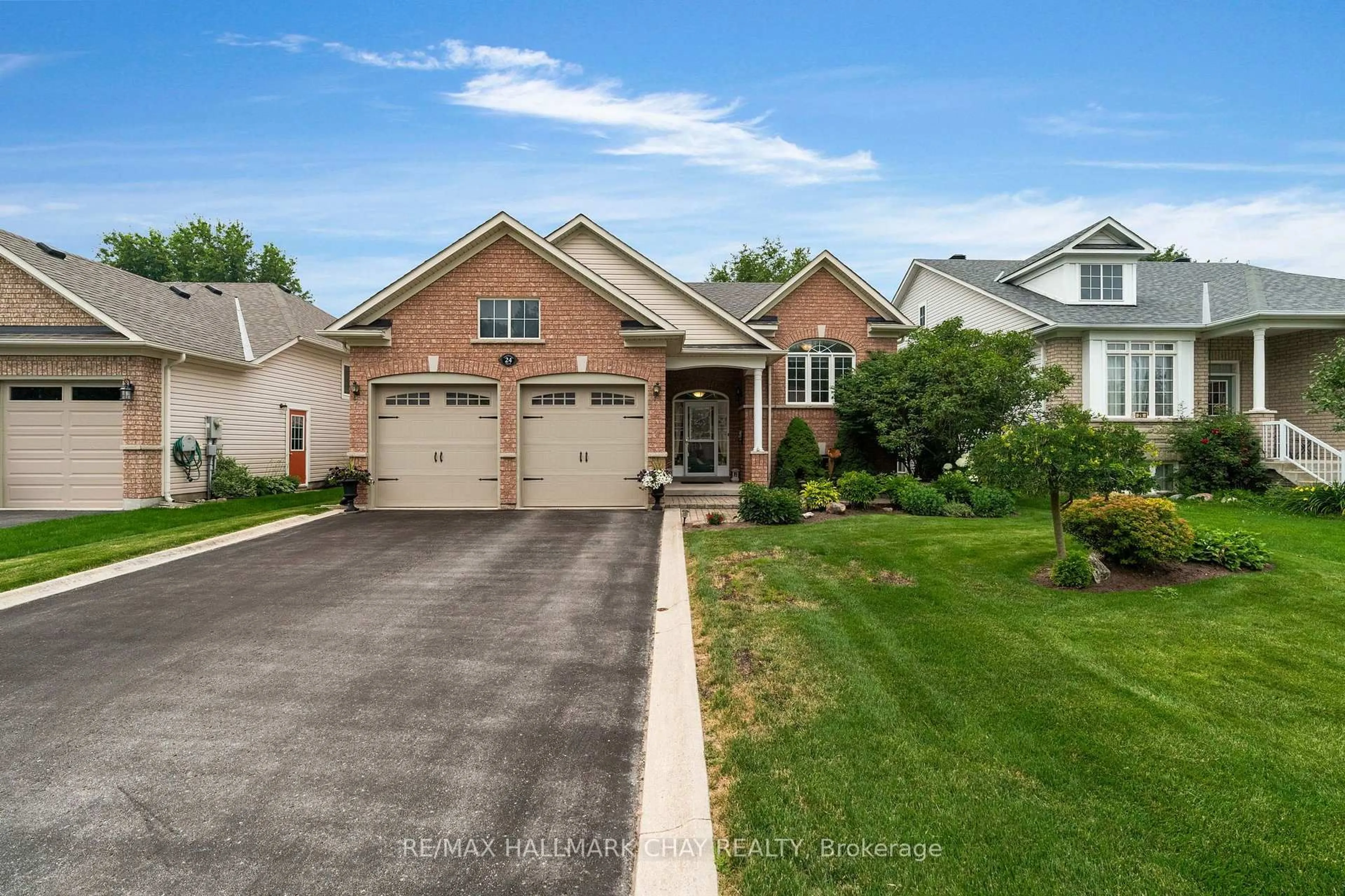 Home with brick exterior material, street for 24 Northwood Dr, Wasaga Beach Ontario L9Z 3B5