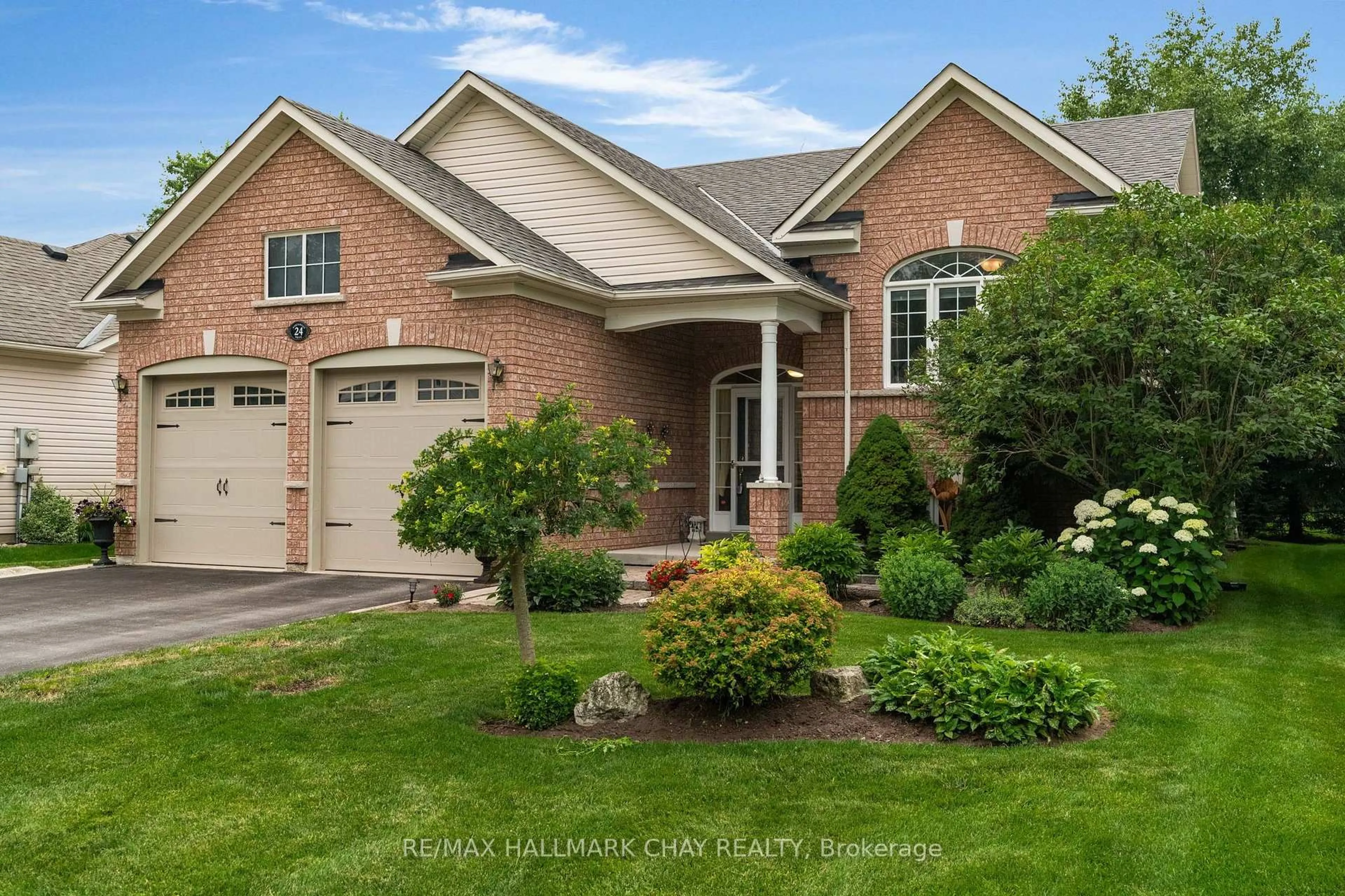 Home with brick exterior material, street for 24 Northwood Dr, Wasaga Beach Ontario L9Z 3B5