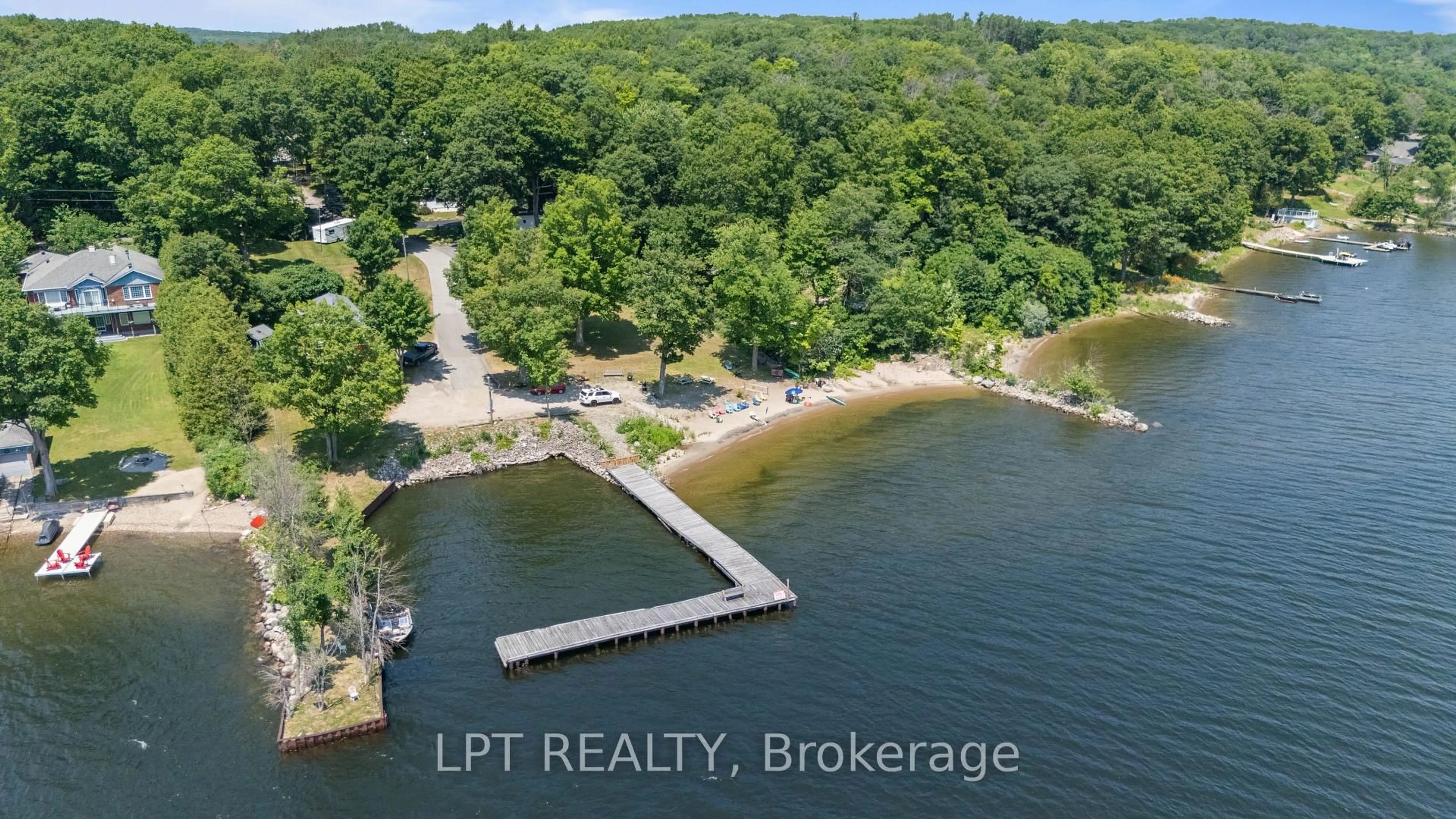 A pic from outside/outdoor area/front of a property/back of a property/a pic from drone, water/lake/river/ocean view for 525 Midland Point Rd #3, Midland Ontario L4R 5G9