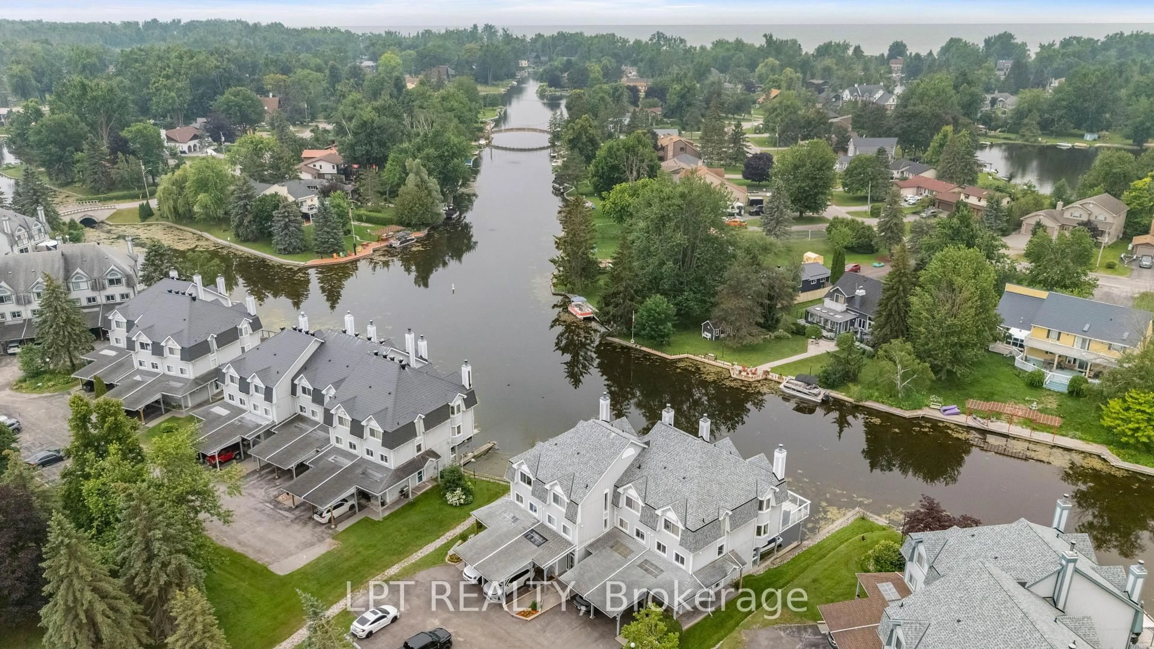 A pic from outside/outdoor area/front of a property/back of a property/a pic from drone, water/lake/river/ocean view for 30 Laguna Pkwy #1, Ramara Ontario L0K 1B0