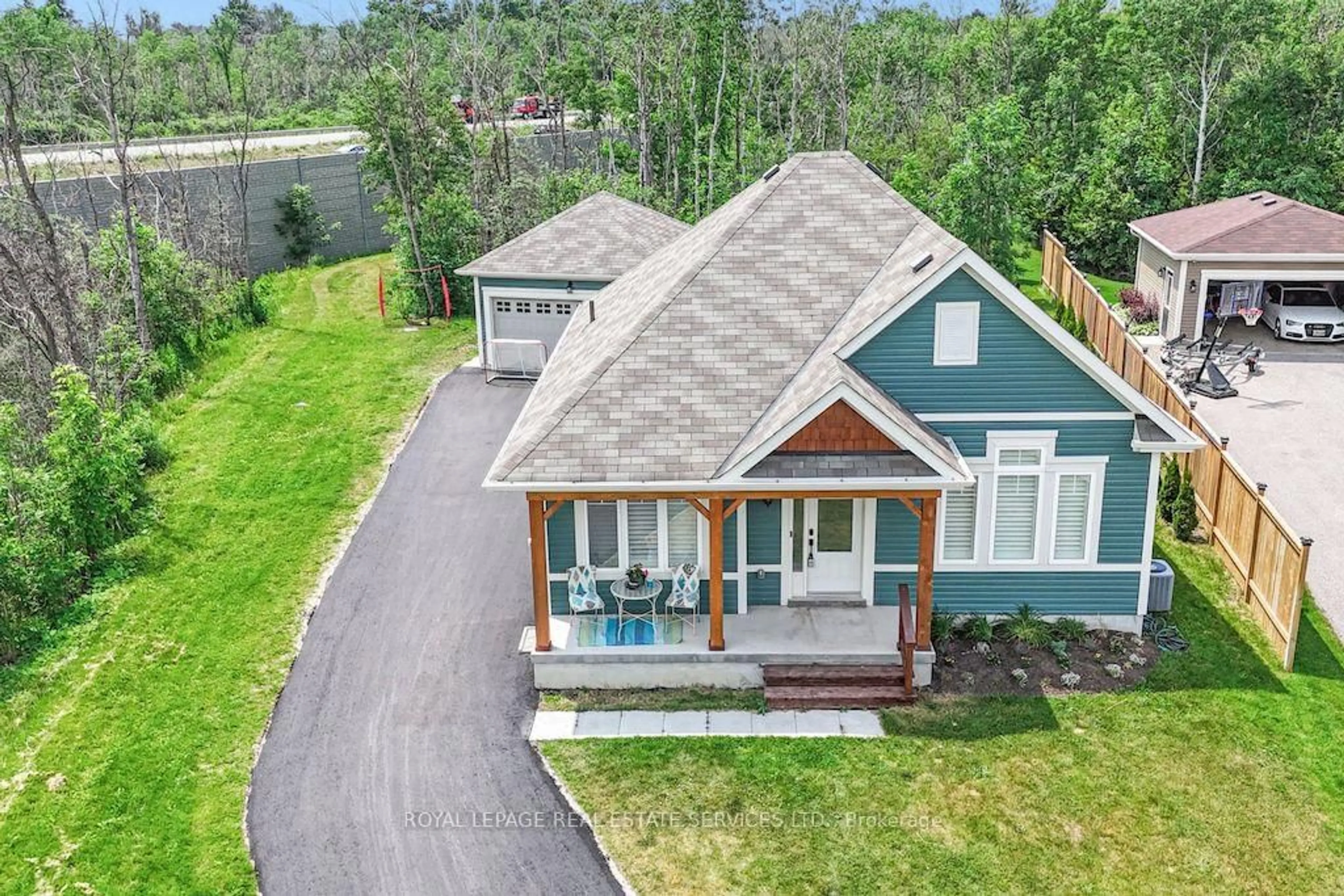 A pic from outside/outdoor area/front of a property/back of a property/a pic from drone, mountain view for 74 Robert St, Wasaga Beach Ontario L9Z 2Y2