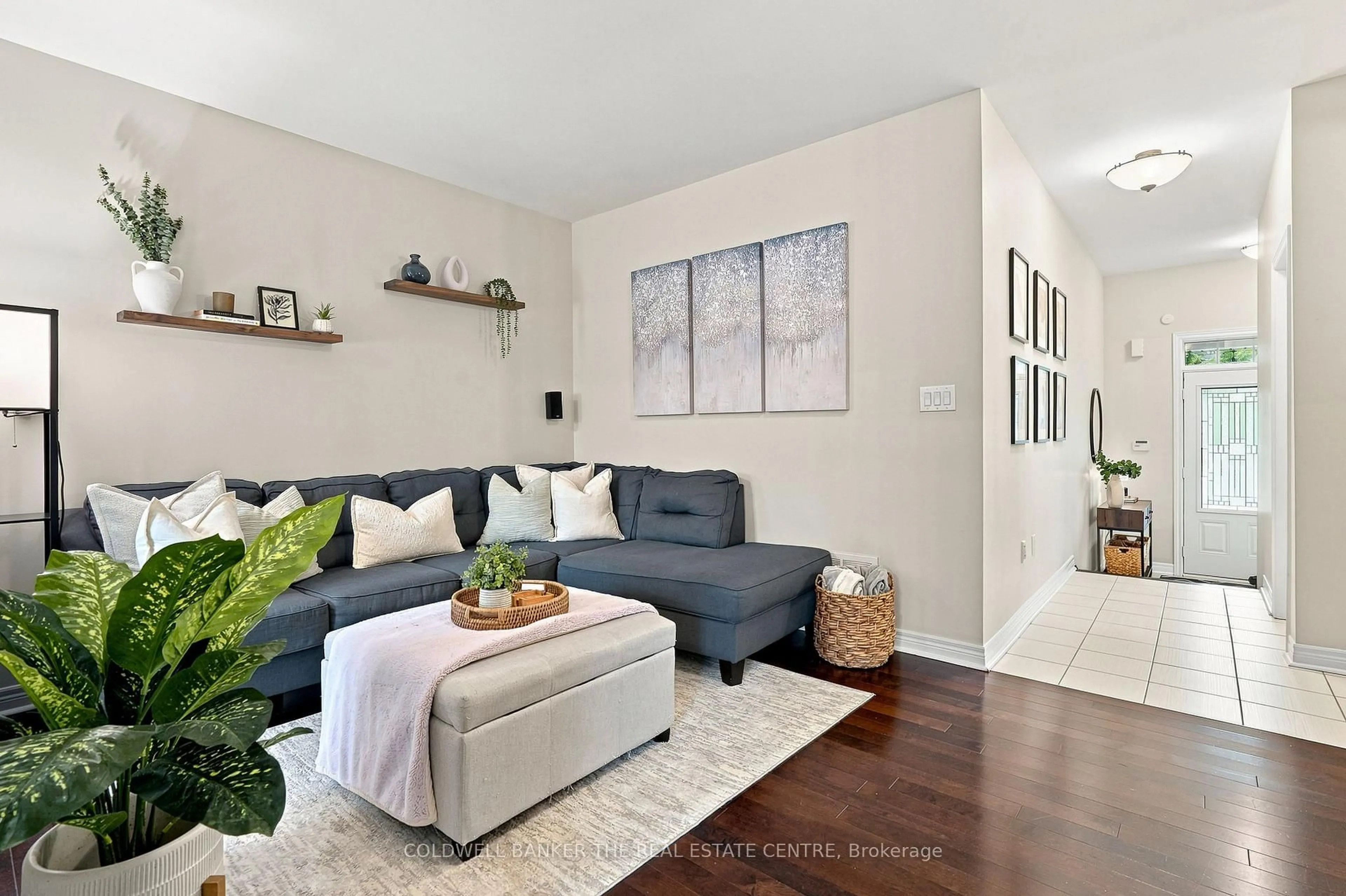 Living room with furniture, wood/laminate floor for 46 Pearcey Cres, Barrie Ontario L4N 6R8