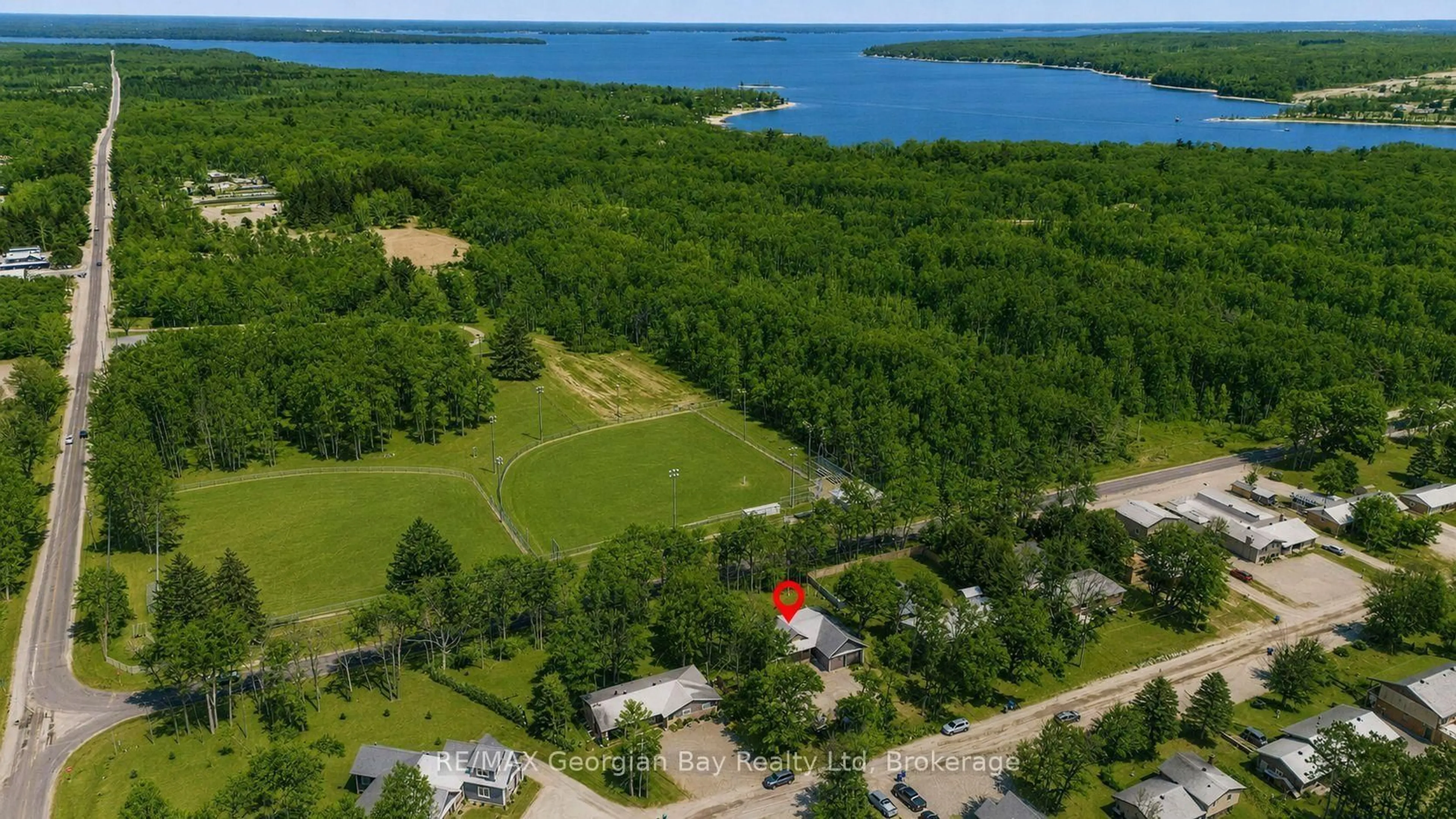 A pic from outside/outdoor area/front of a property/back of a property/a pic from drone, water/lake/river/ocean view for 49 Beaufort Cres, Tiny Ontario L9M 0B8
