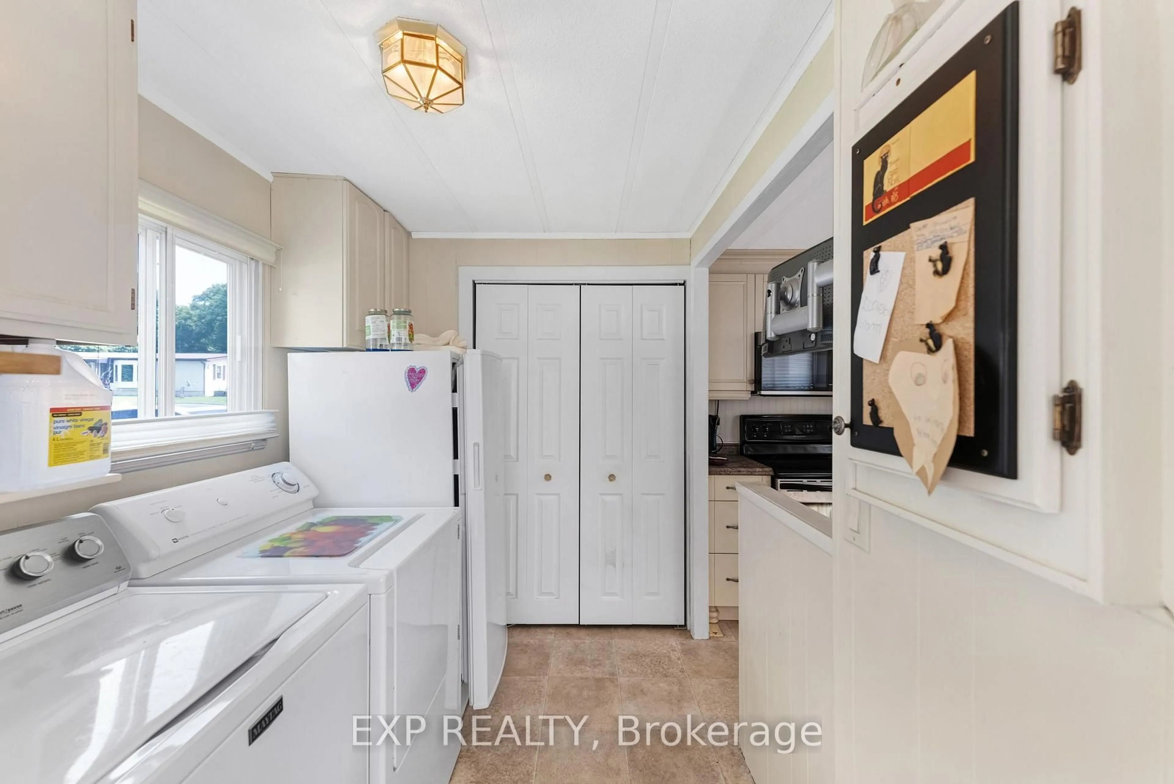 Kitchen with laundary machines, ceramic/tile floor for 5263 Elliot Sdrd #5, Tay Ontario L4R 4K3
