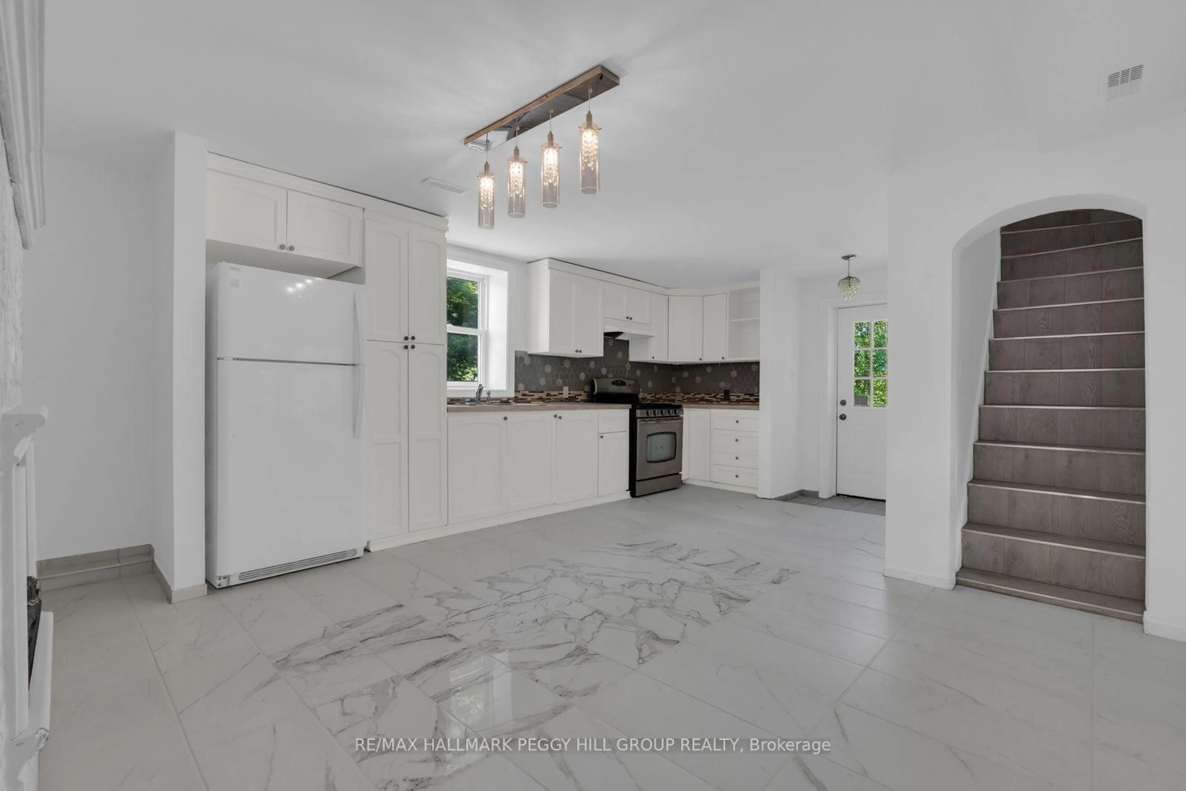 Open concept kitchen, ceramic/tile floor for 132 Queen St, Springwater Ontario L0L 1P0