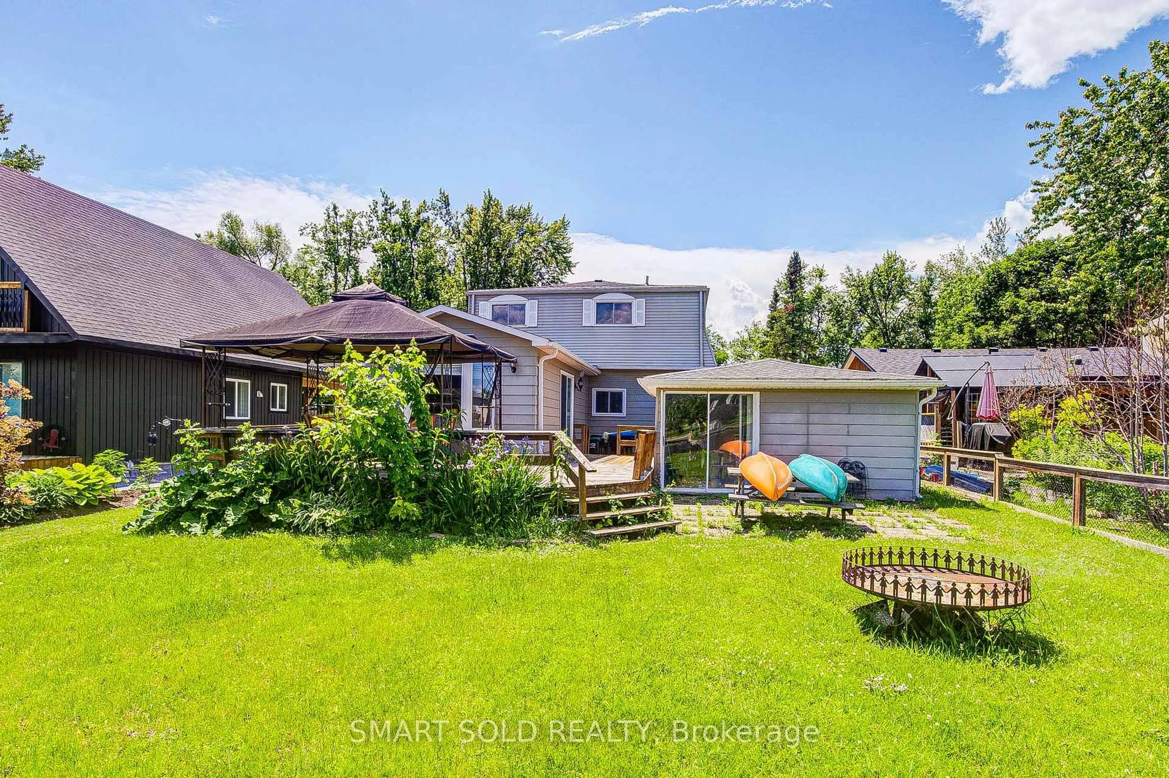 A pic from outside/outdoor area/front of a property/back of a property/a pic from drone, water/lake/river/ocean view for 75 Lake Ave, Ramara Ontario L0K 1B0
