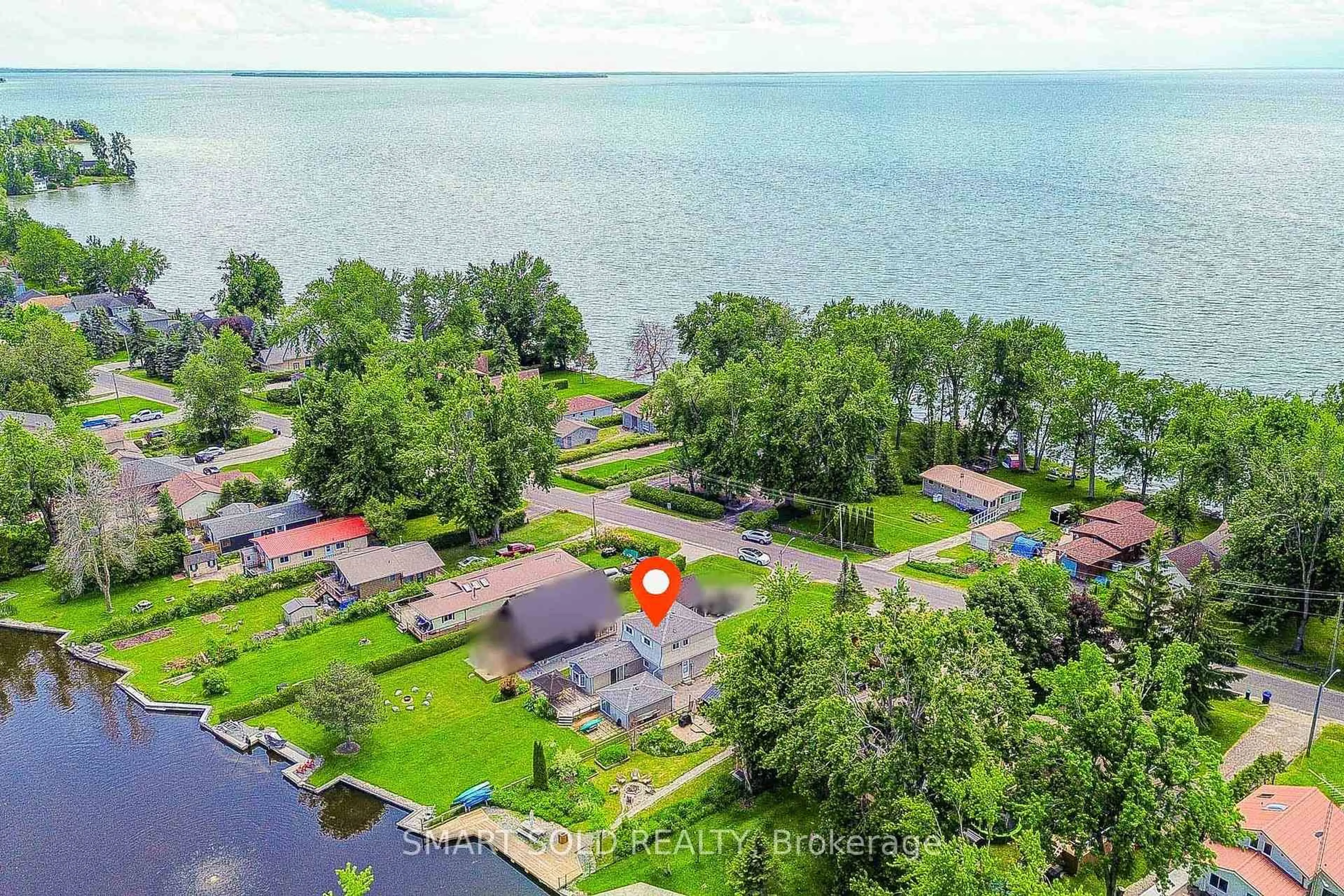 A pic from outside/outdoor area/front of a property/back of a property/a pic from drone, water/lake/river/ocean view for 75 Lake Ave, Ramara Ontario L0K 1B0