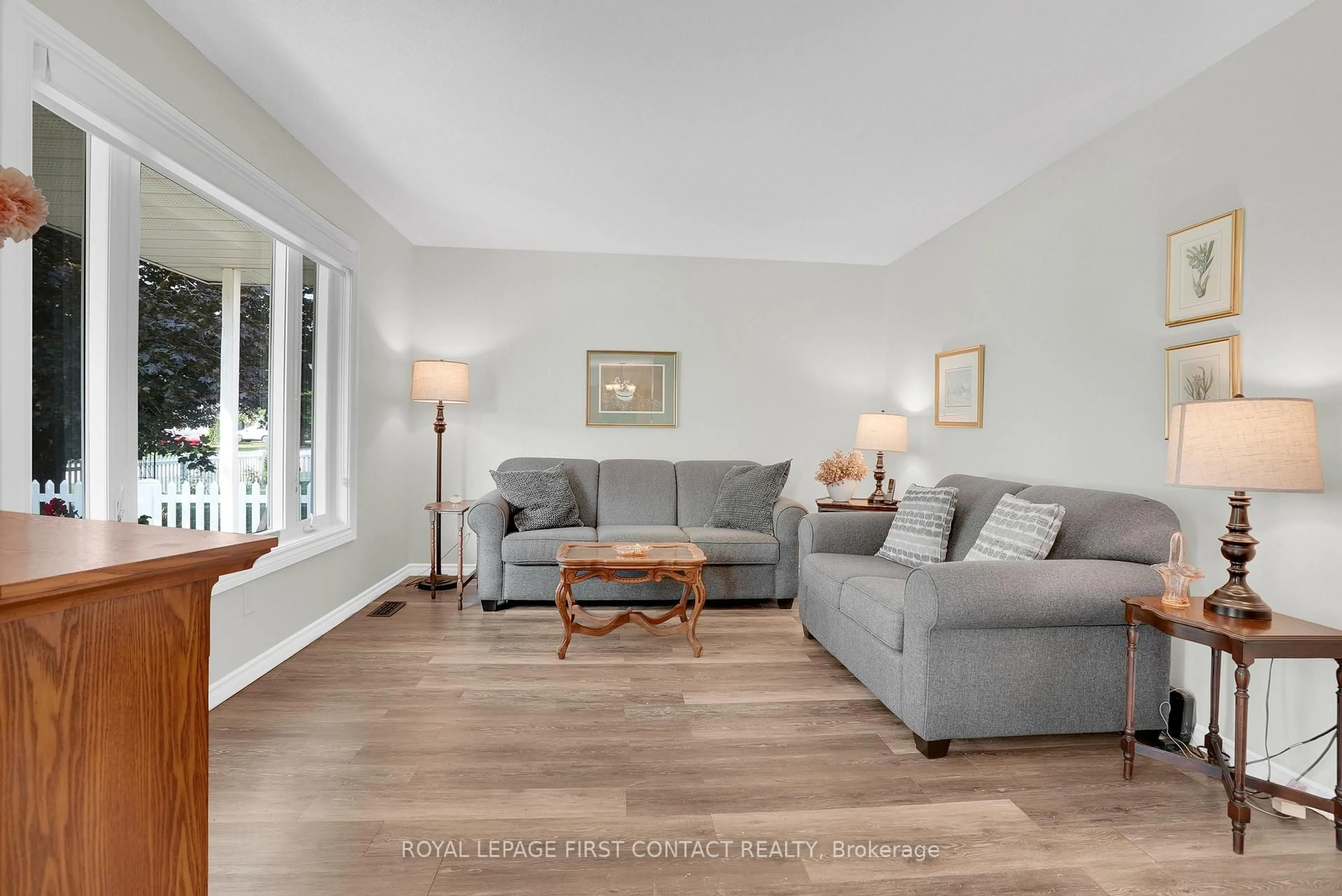 Living room with furniture, wood/laminate floor for 214 Point St, Clearview Ontario L0M 1S0