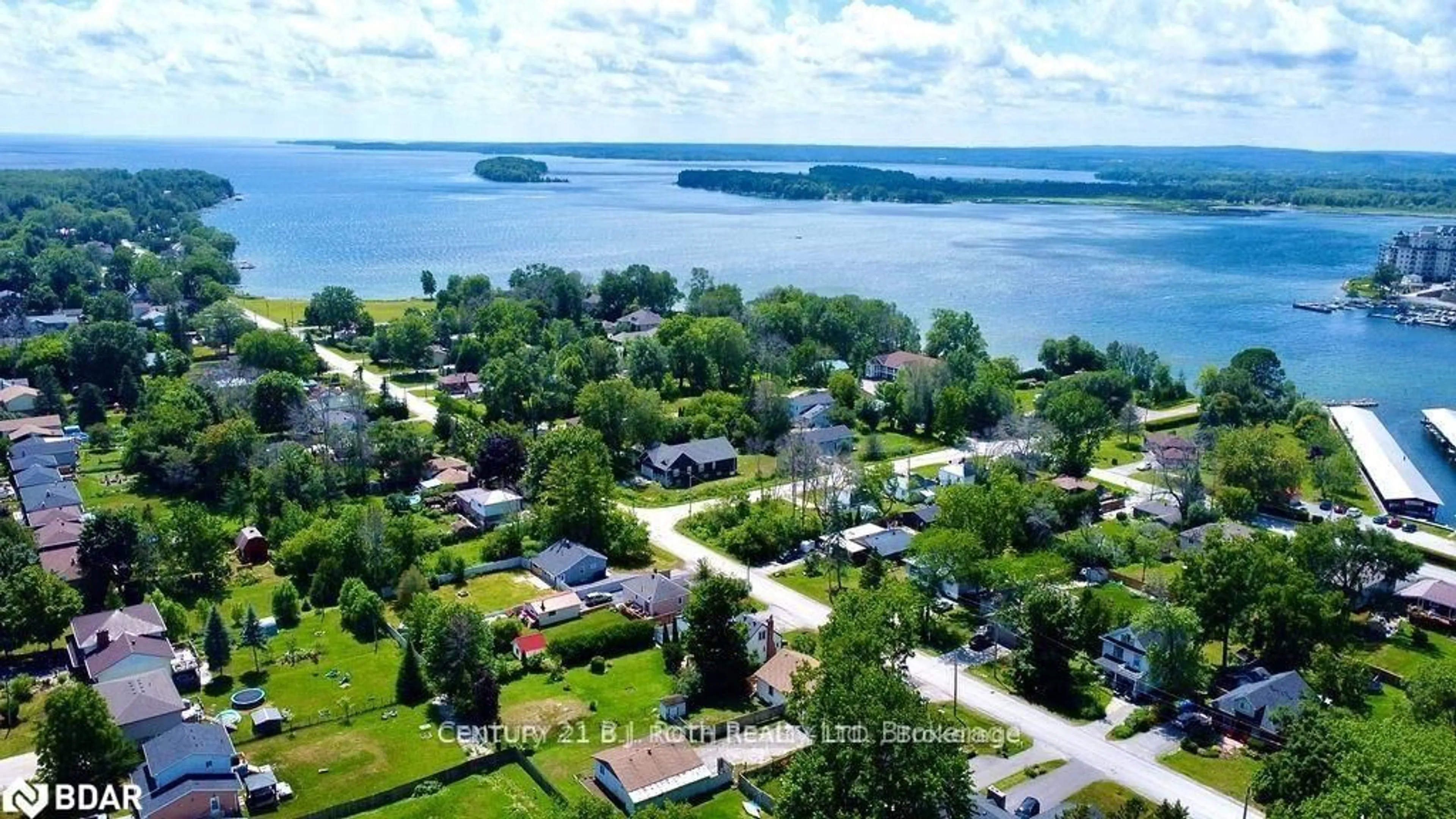 A pic from outside/outdoor area/front of a property/back of a property/a pic from drone, water/lake/river/ocean view for 12 PATRICIA Dr, Ramara Ontario L3V 6N1