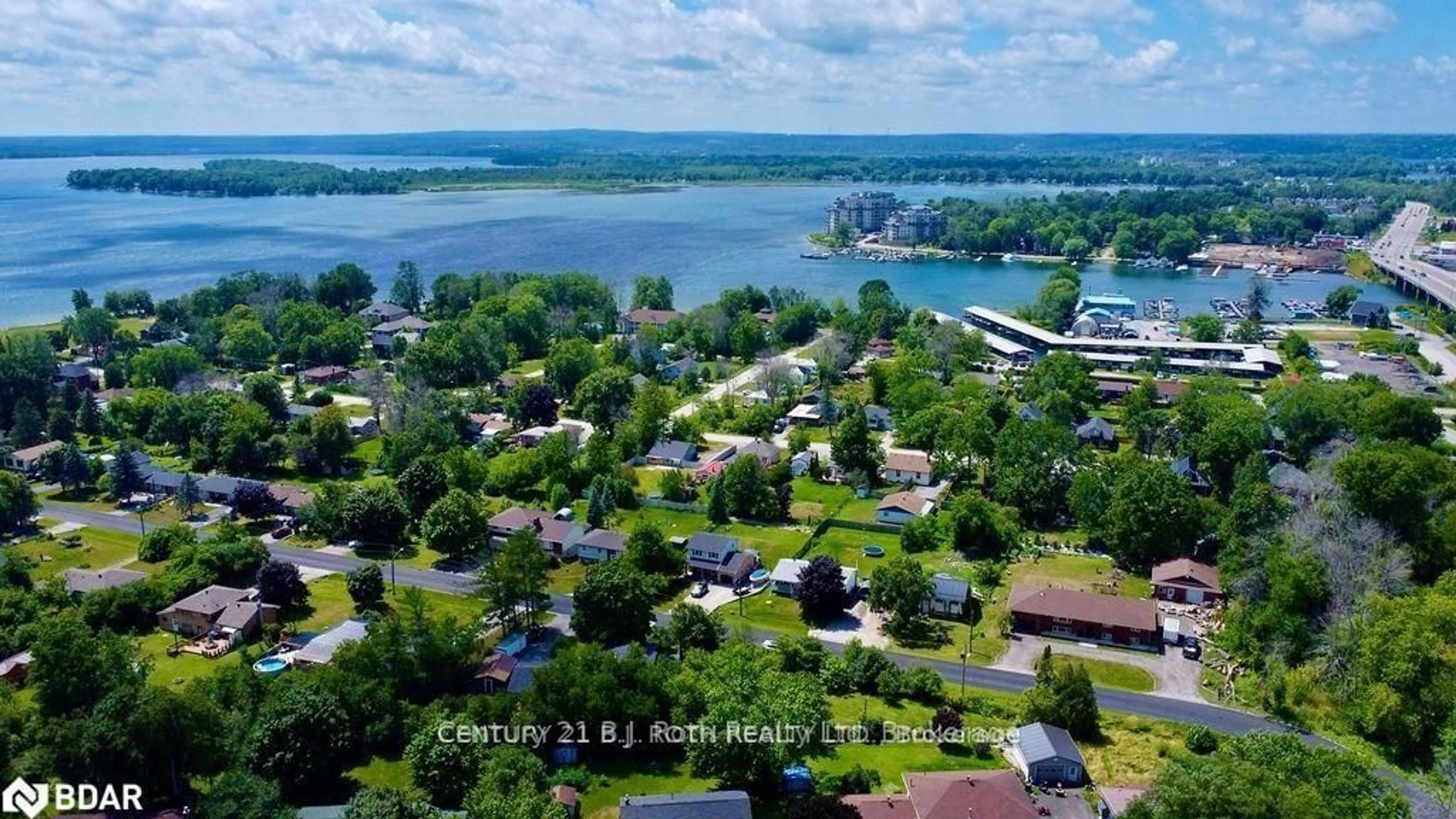 A pic from outside/outdoor area/front of a property/back of a property/a pic from drone, water/lake/river/ocean view for 12 PATRICIA Dr, Ramara Ontario L3V 6N1