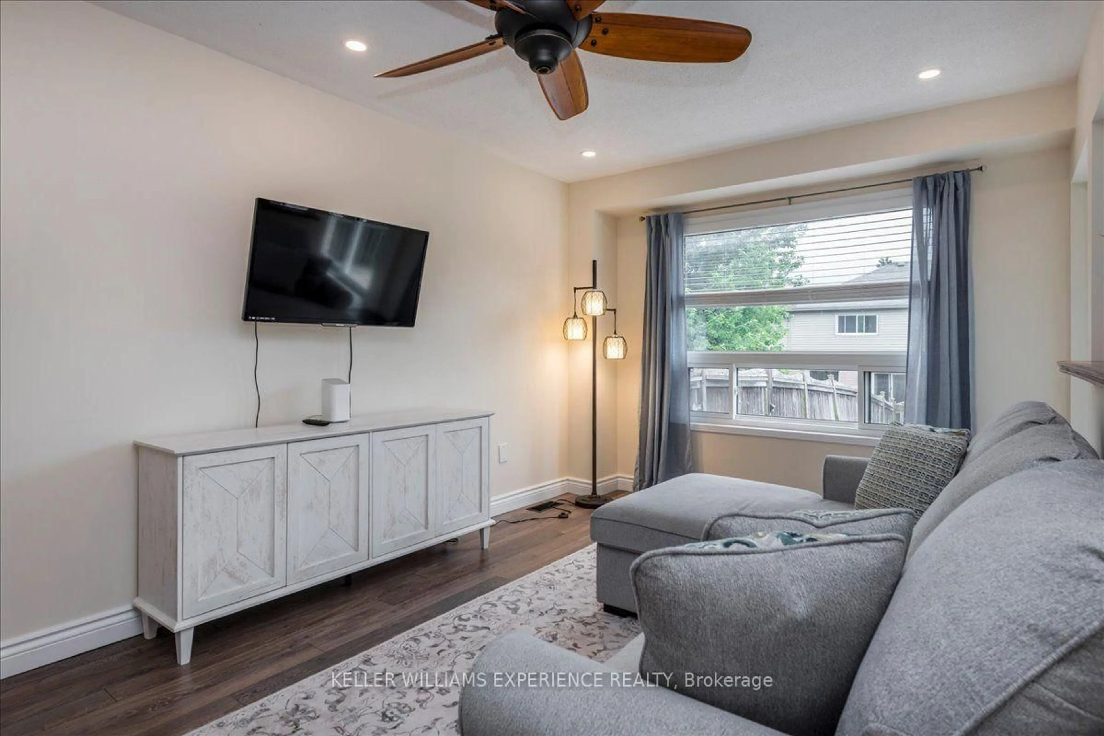 Living room with furniture, wood/laminate floor for 10 SUNSET Pl, Barrie Ontario L4N 0T7