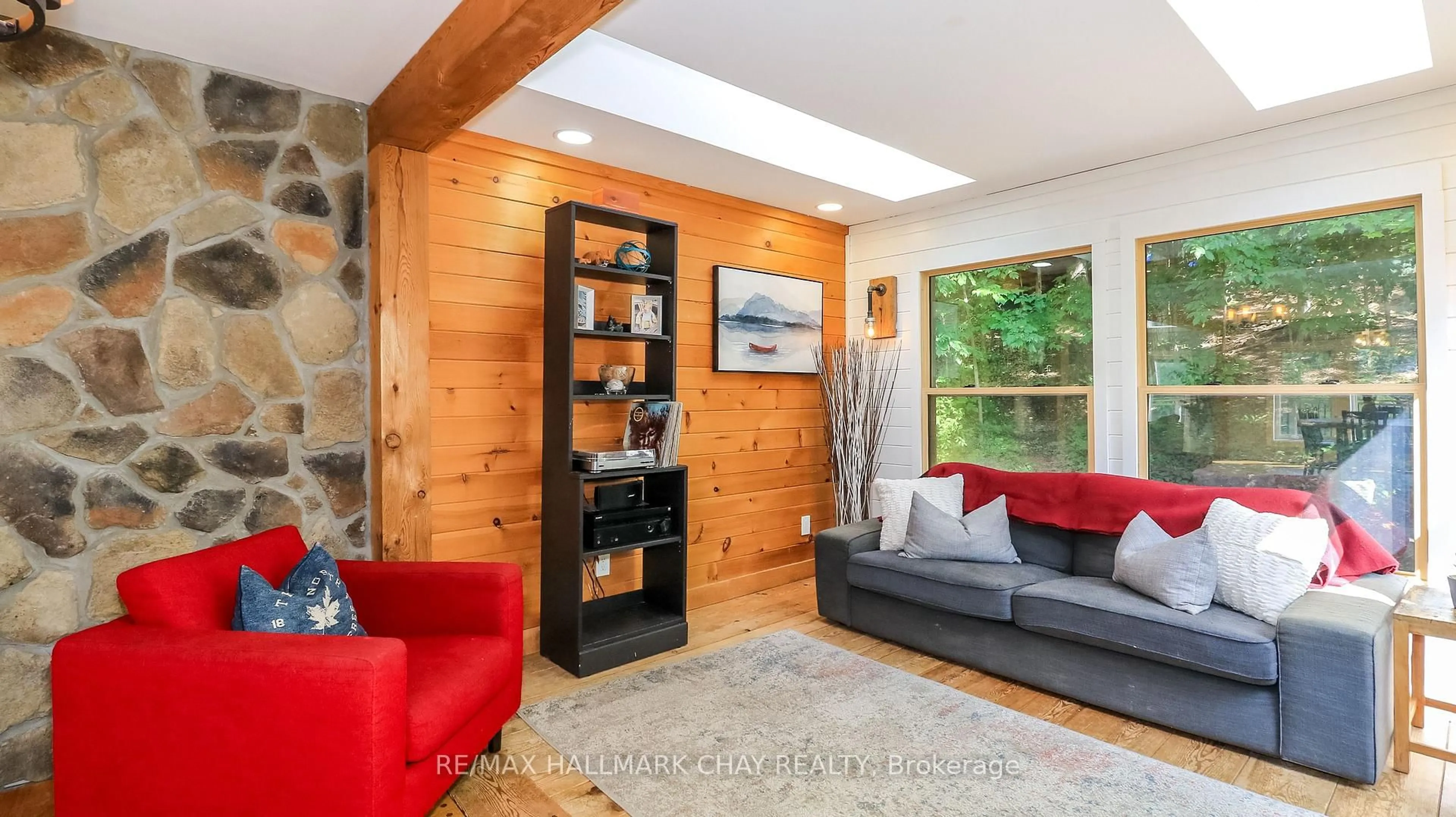 Living room with furniture, wood/laminate floor for 46 Pine Ridge Tr, Oro-Medonte Ontario L4M 4Y8