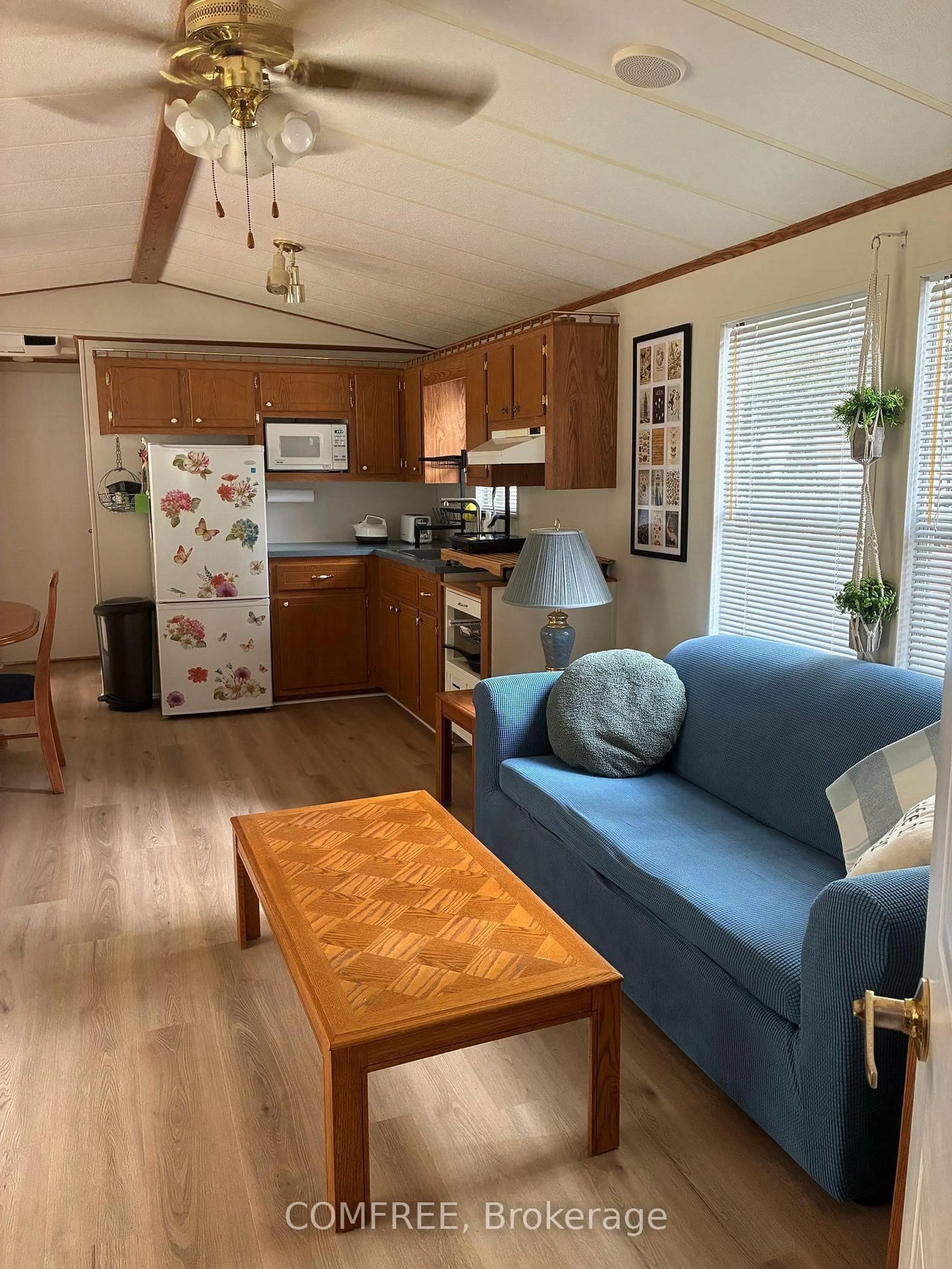 Living room with furniture, wood/laminate floor for 85 Theme Park Dr #82, Wasaga Beach Ontario L9Z 1X7