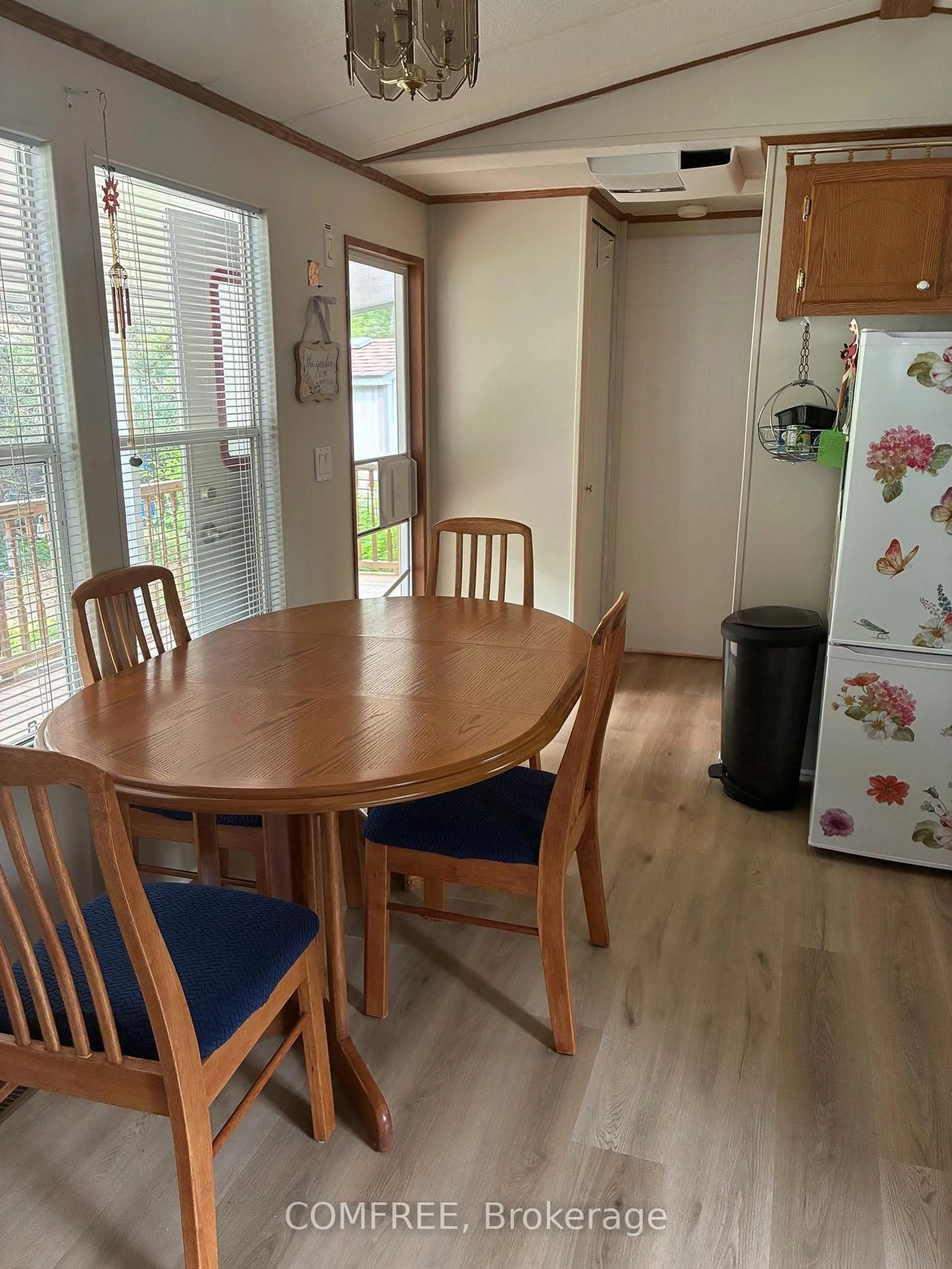 Dining room, wood/laminate floor for 85 Theme Park Dr #82, Wasaga Beach Ontario L9Z 1X7