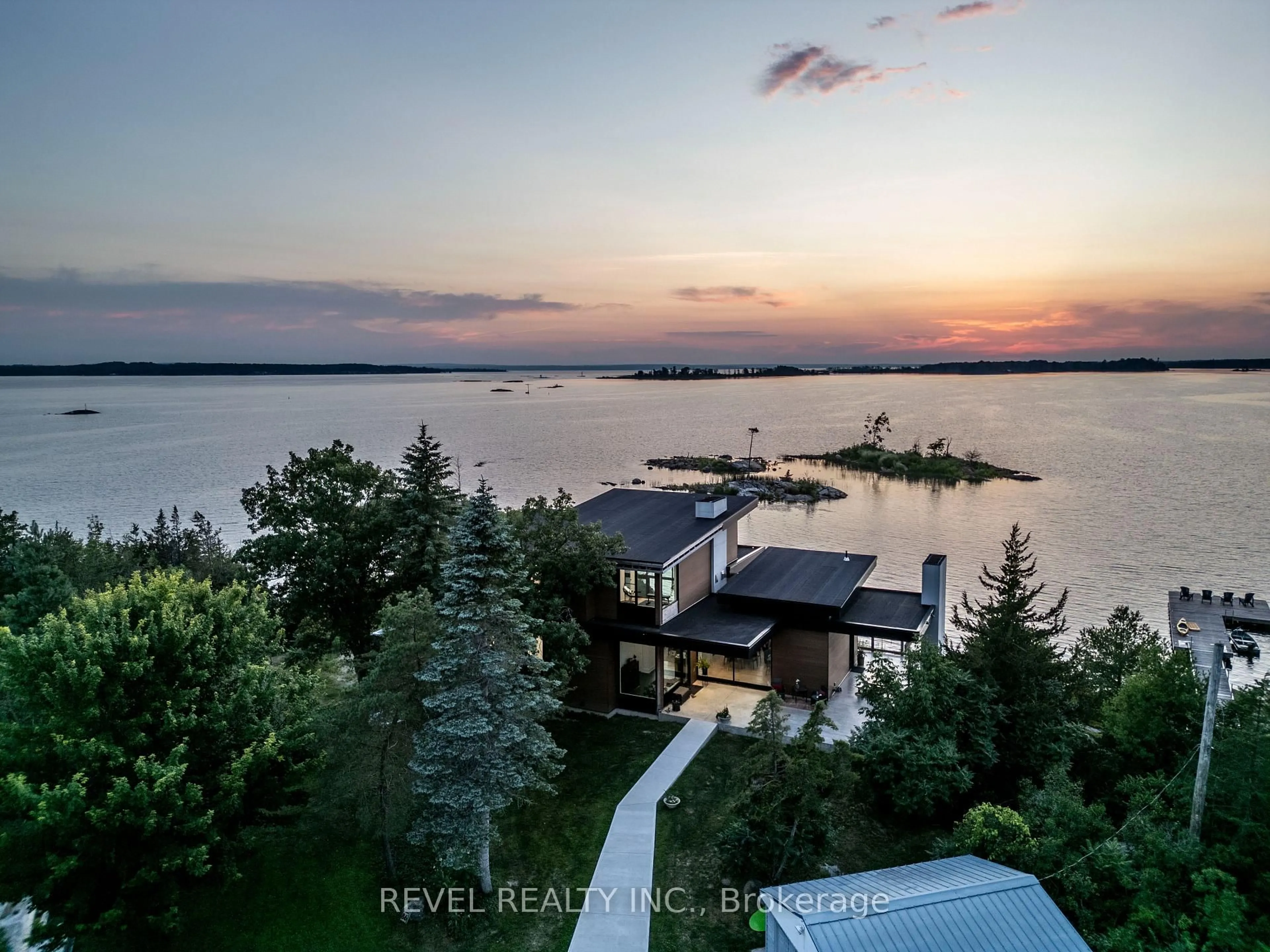 A pic from outside/outdoor area/front of a property/back of a property/a pic from drone, water/lake/river/ocean view for 86 Long Point Rd, Tay Ontario L0K 2C0
