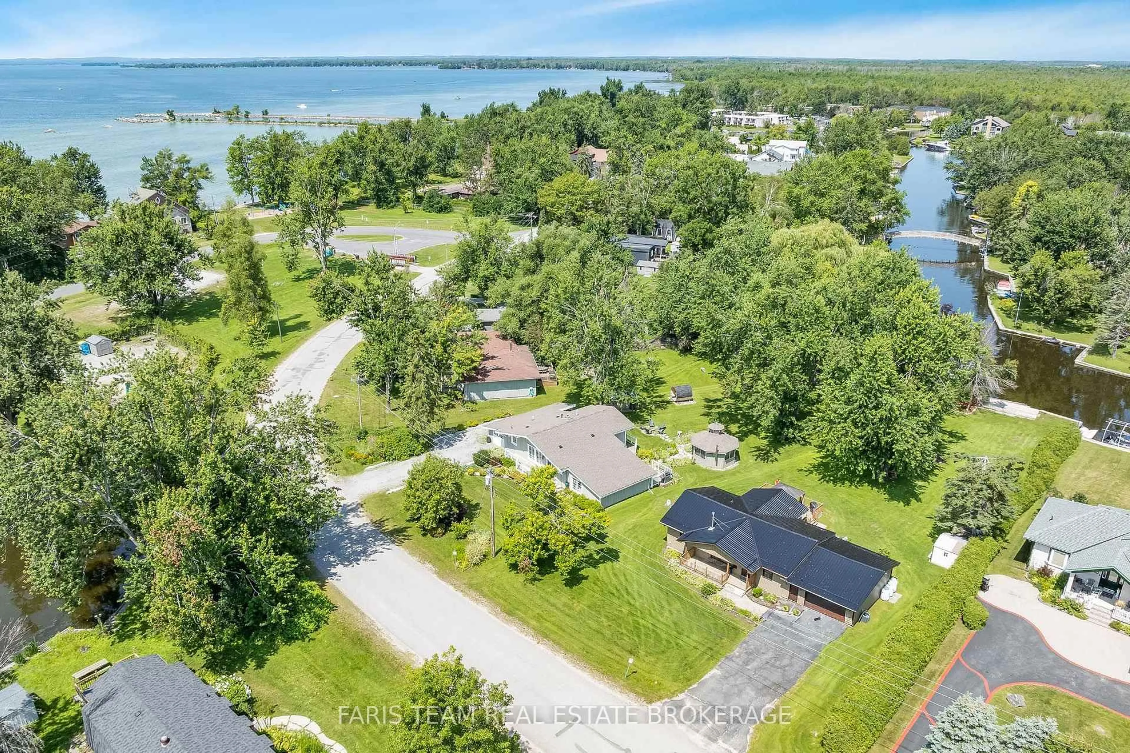 A pic from outside/outdoor area/front of a property/back of a property/a pic from drone, water/lake/river/ocean view for 27 Poplar Cres, Ramara Ontario L0K 1B0