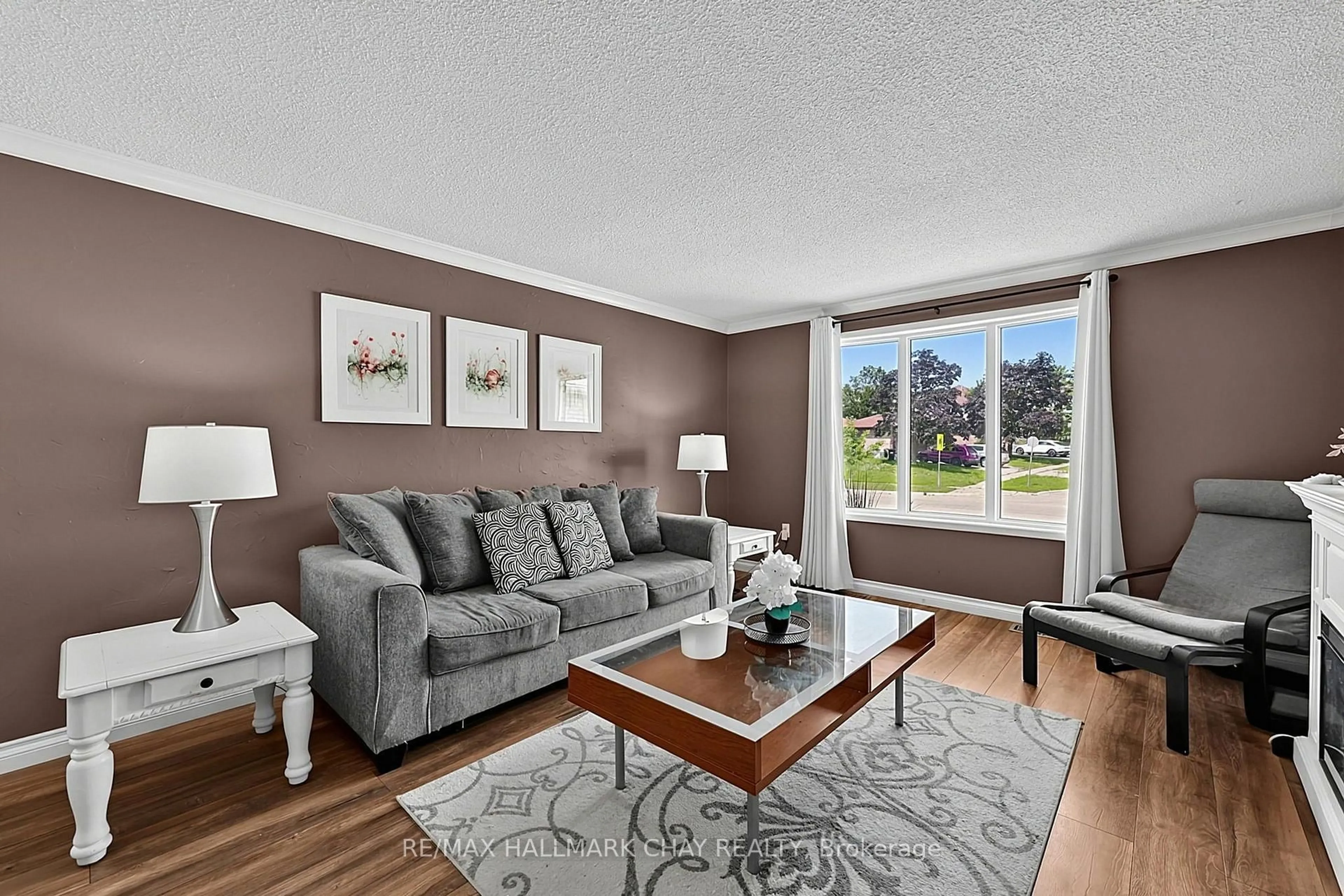 Living room with furniture, unknown for 73 Browning Tr, Barrie Ontario L4N 6J4