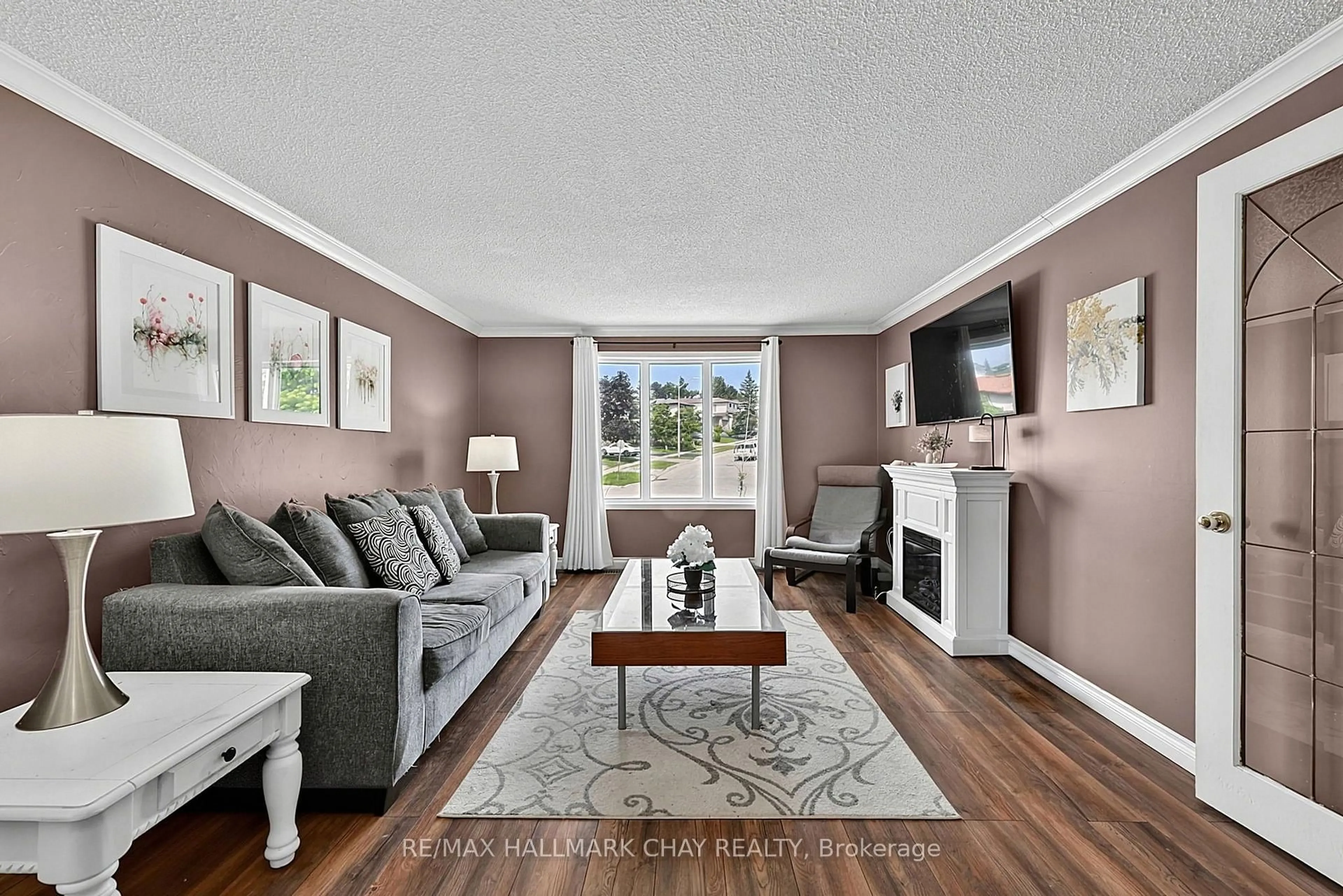 Living room with furniture, unknown for 73 Browning Tr, Barrie Ontario L4N 6J4