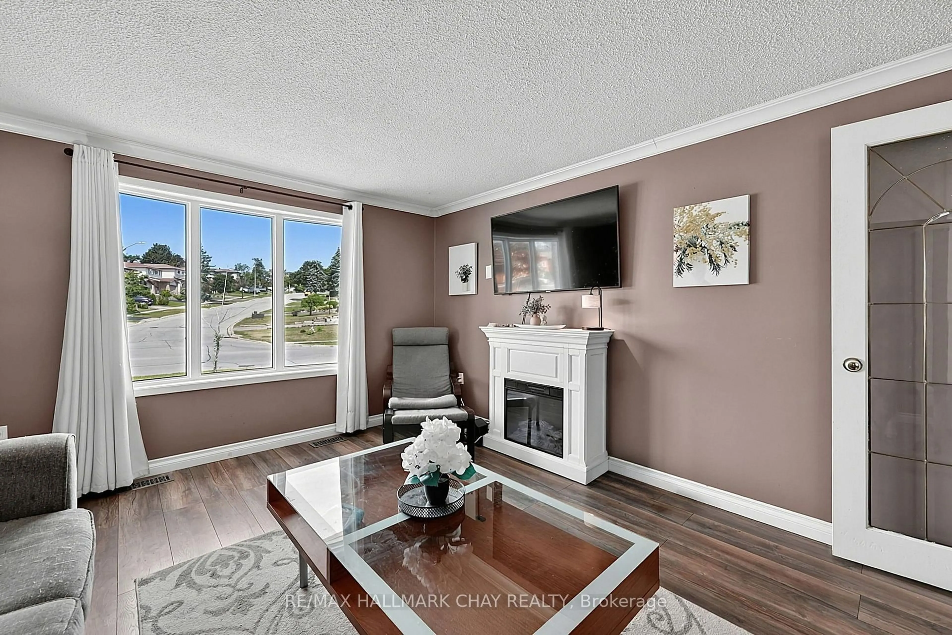 Living room with furniture, unknown for 73 Browning Tr, Barrie Ontario L4N 6J4