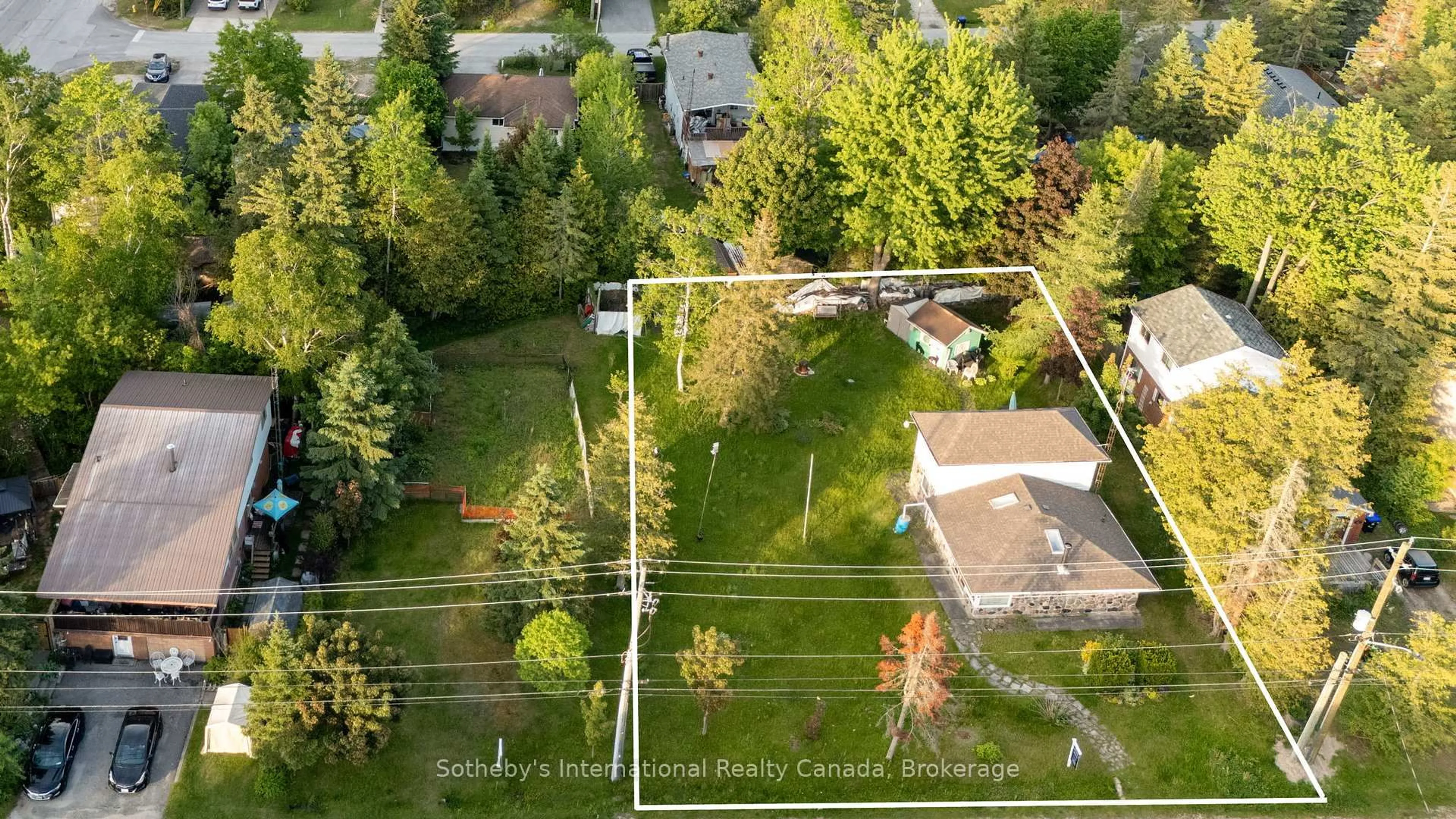 A pic from outside/outdoor area/front of a property/back of a property/a pic from drone, street for 19 62nd St, Wasaga Beach Ontario L9Z 1V5