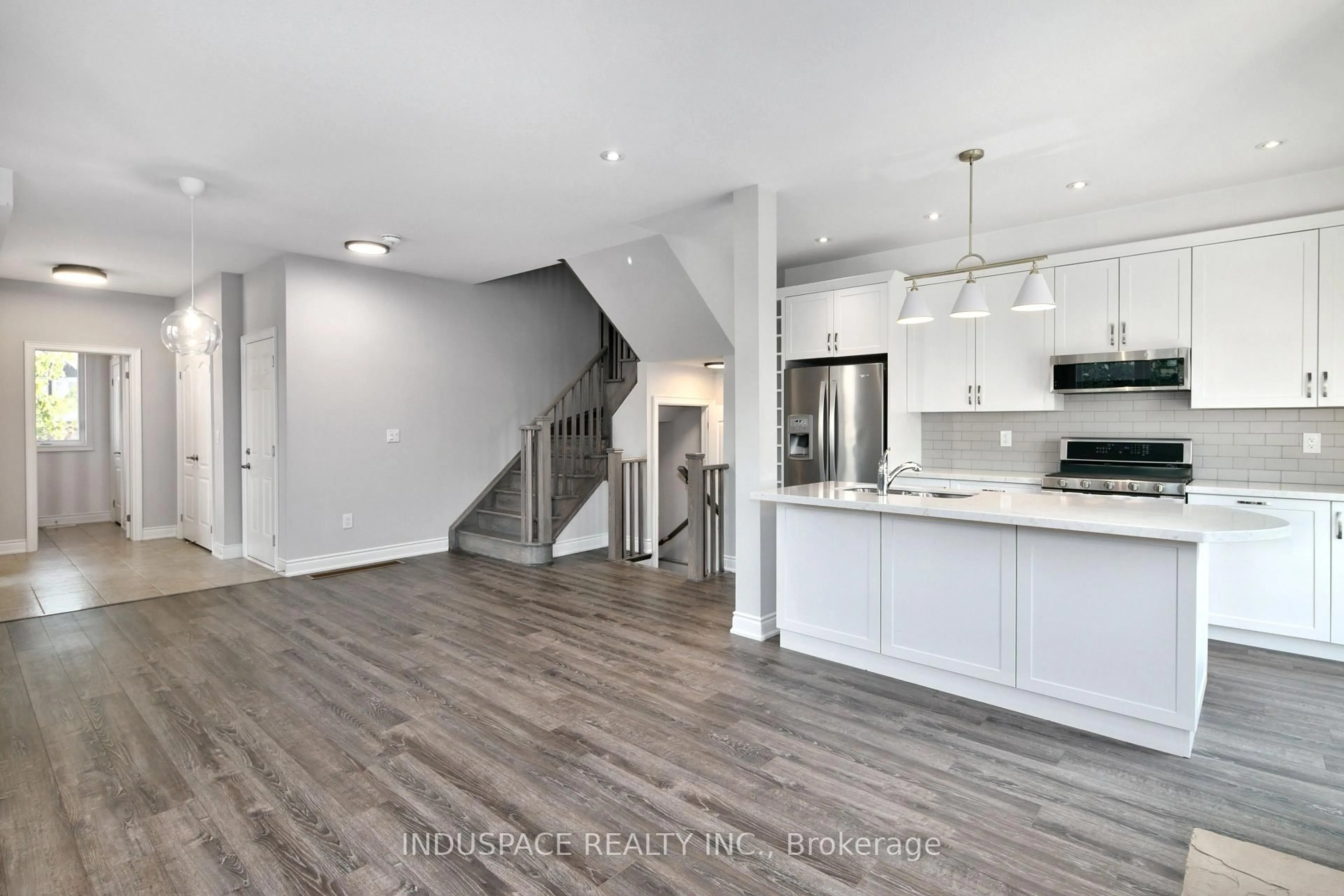 Open concept kitchen, wood/laminate floor for 1 Kennedy Ave, Collingwood Ontario L9Y 0Z5