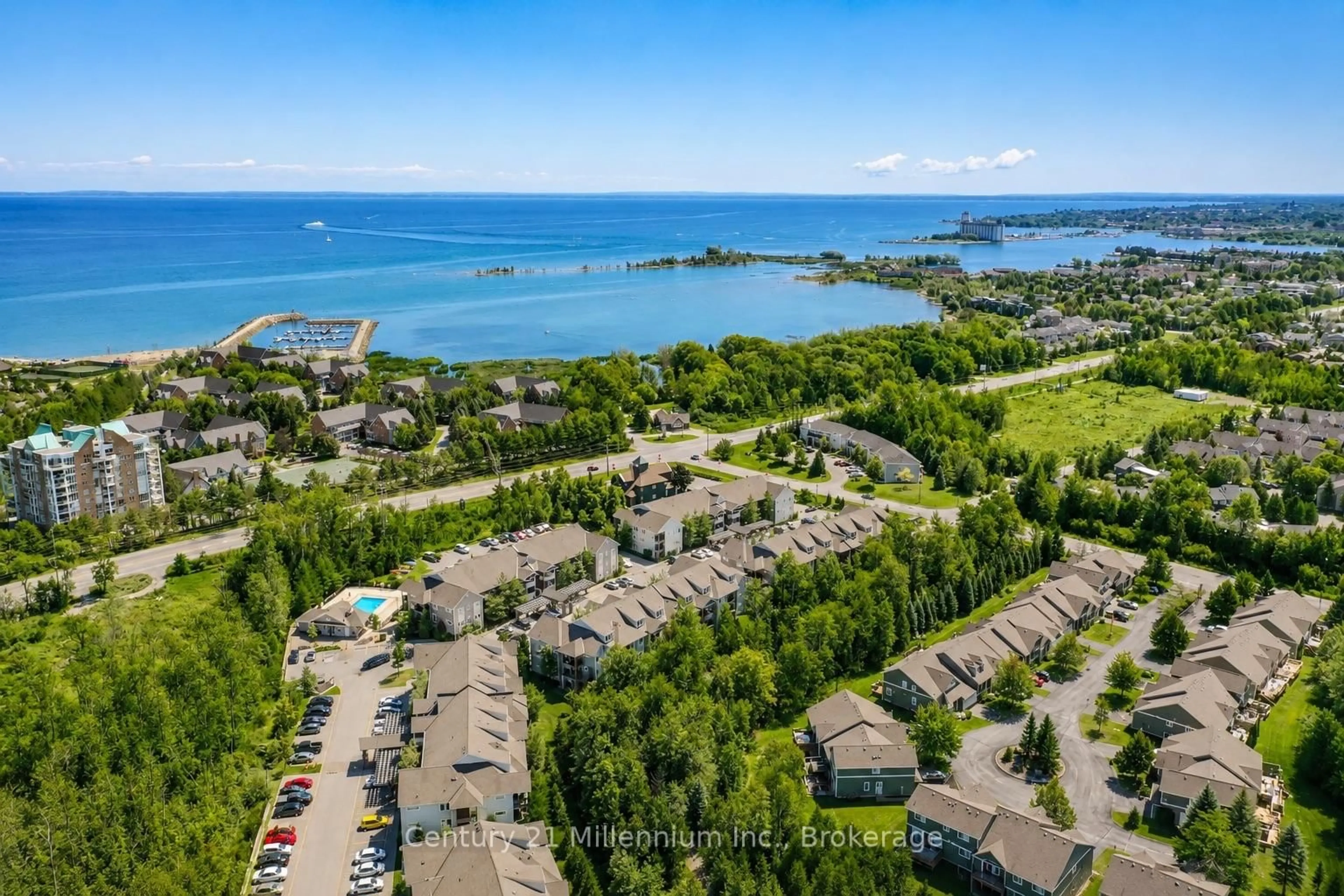 A pic from outside/outdoor area/front of a property/back of a property/a pic from drone, water/lake/river/ocean view for 10 Brandy Lane Dr #204, Collingwood Ontario L9Y 0X4
