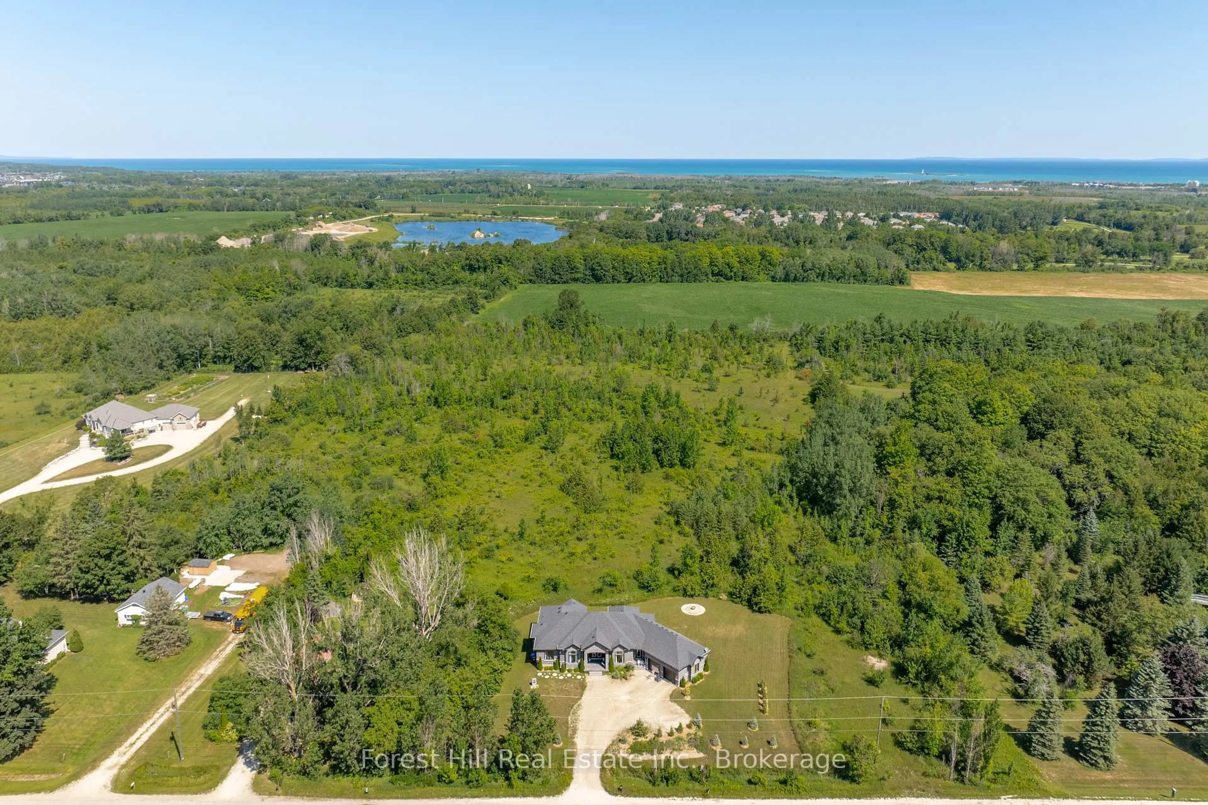A pic from outside/outdoor area/front of a property/back of a property/a pic from drone, water/lake/river/ocean view for 1029 Sixth St, Collingwood Ontario L9Y 3Y9